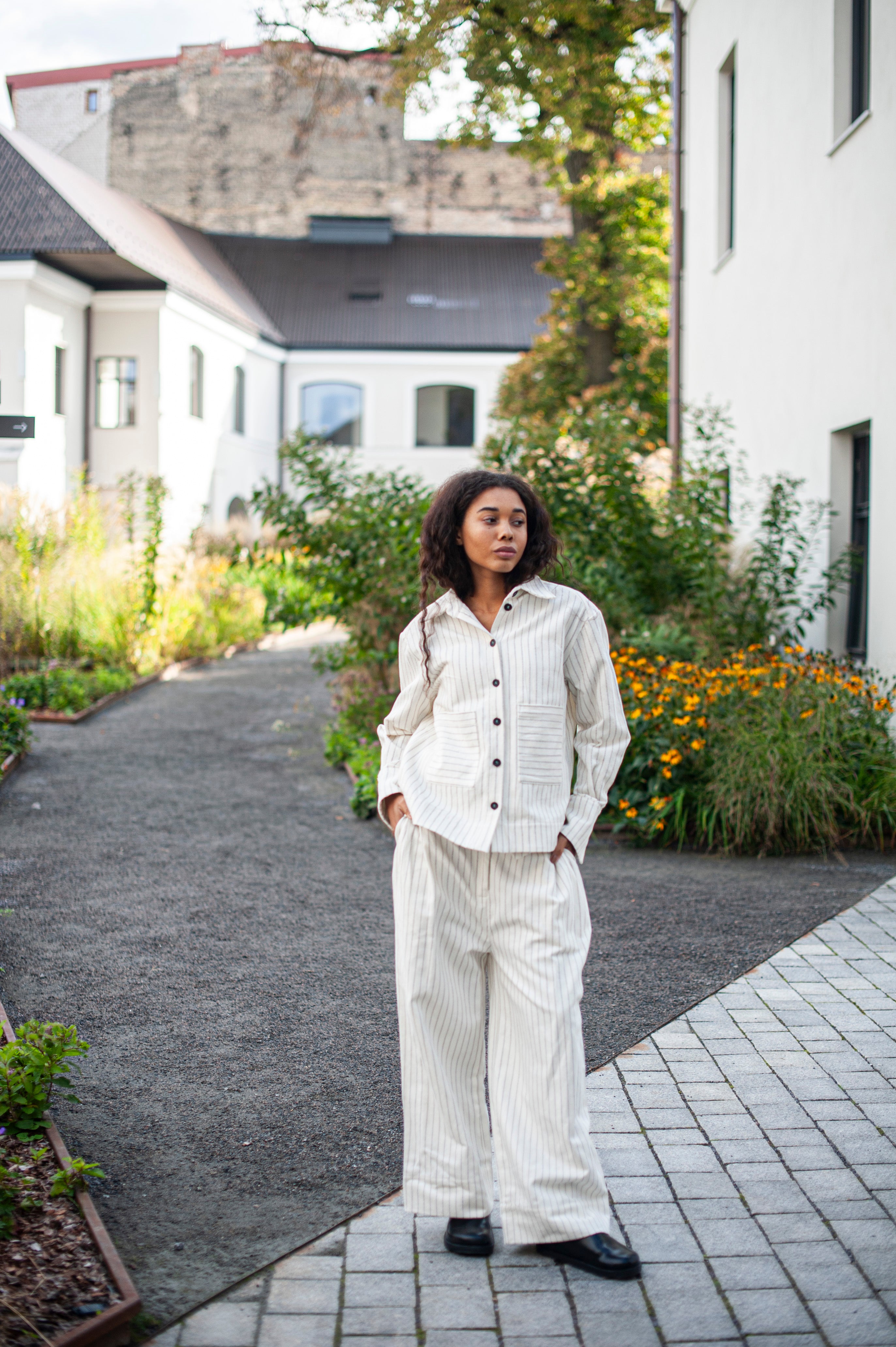 Classic palazzo pants and a matching collar jacket with black buttons