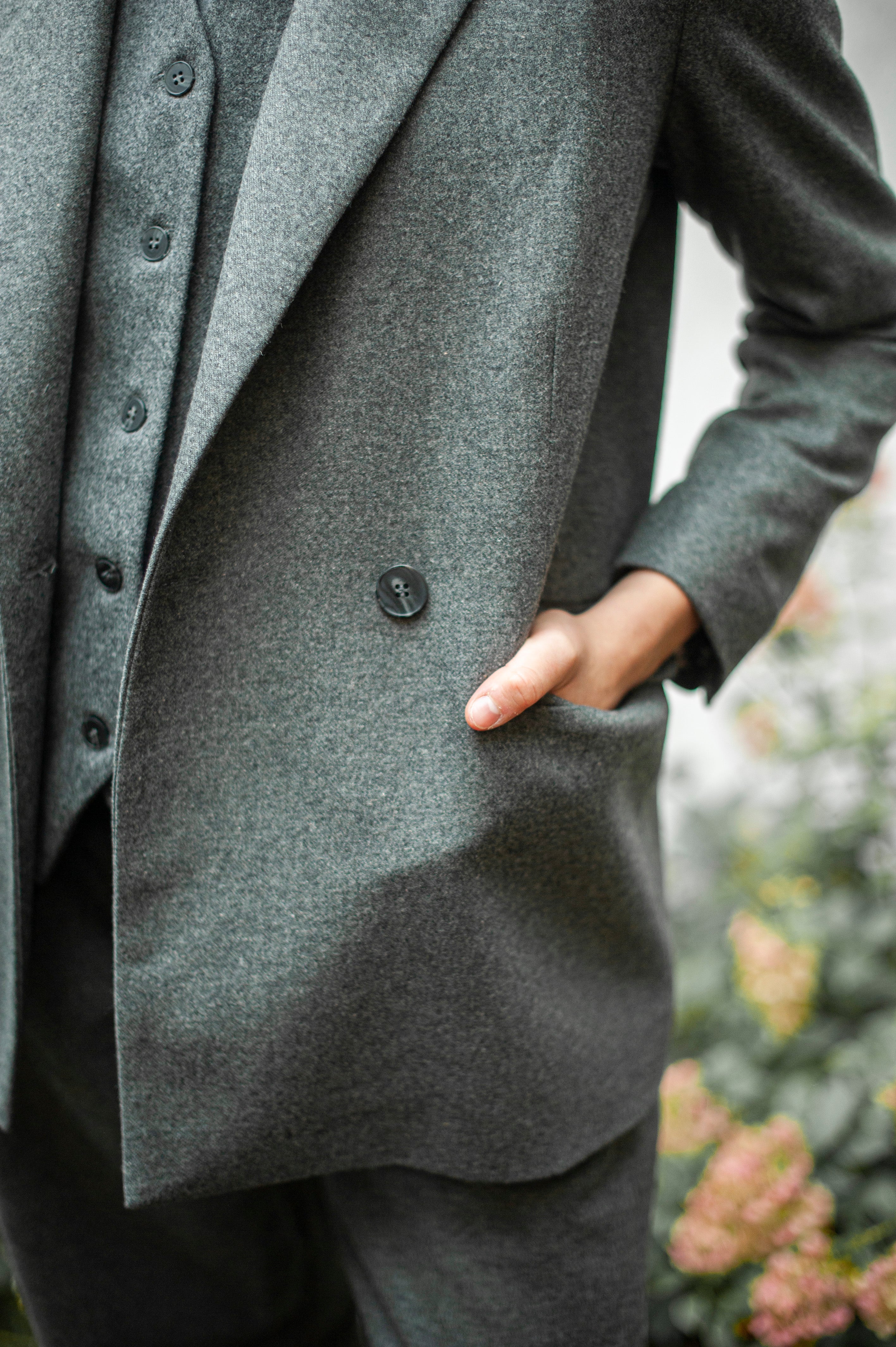 Grey double-breasted suit with flat front pockets.