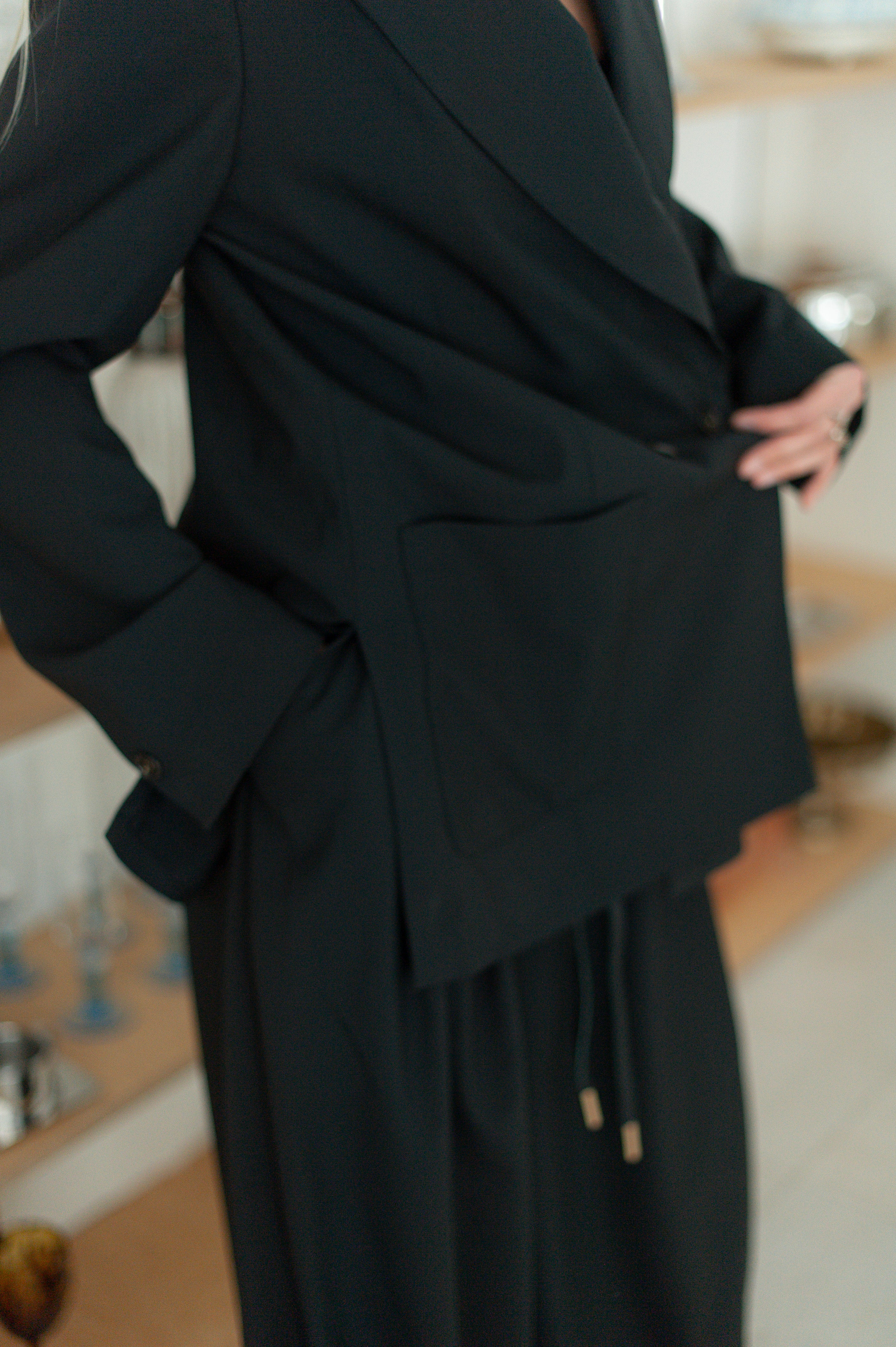 Close-up of wool blazer showing side slit