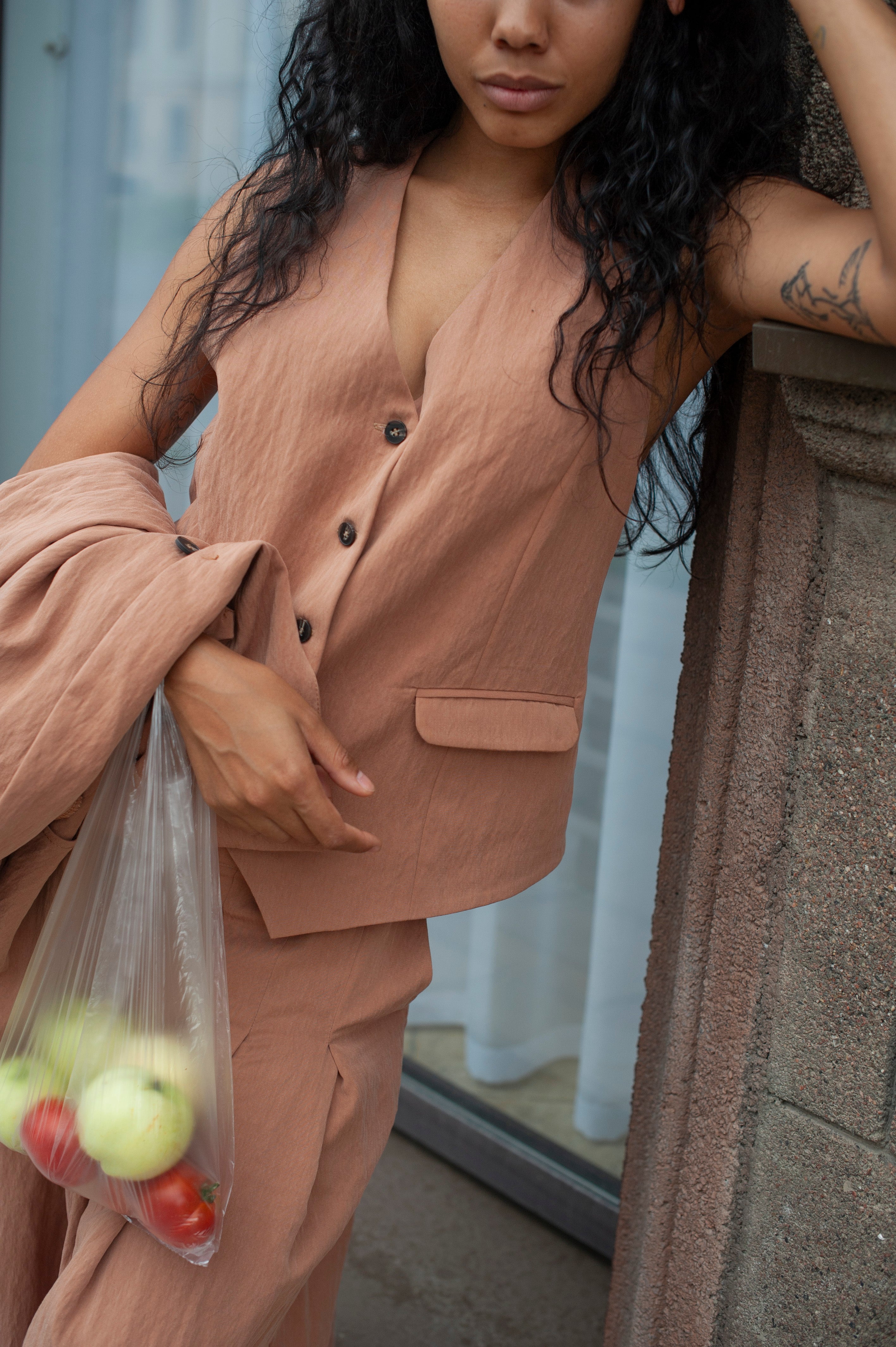 Light beige linen suit vest for women.