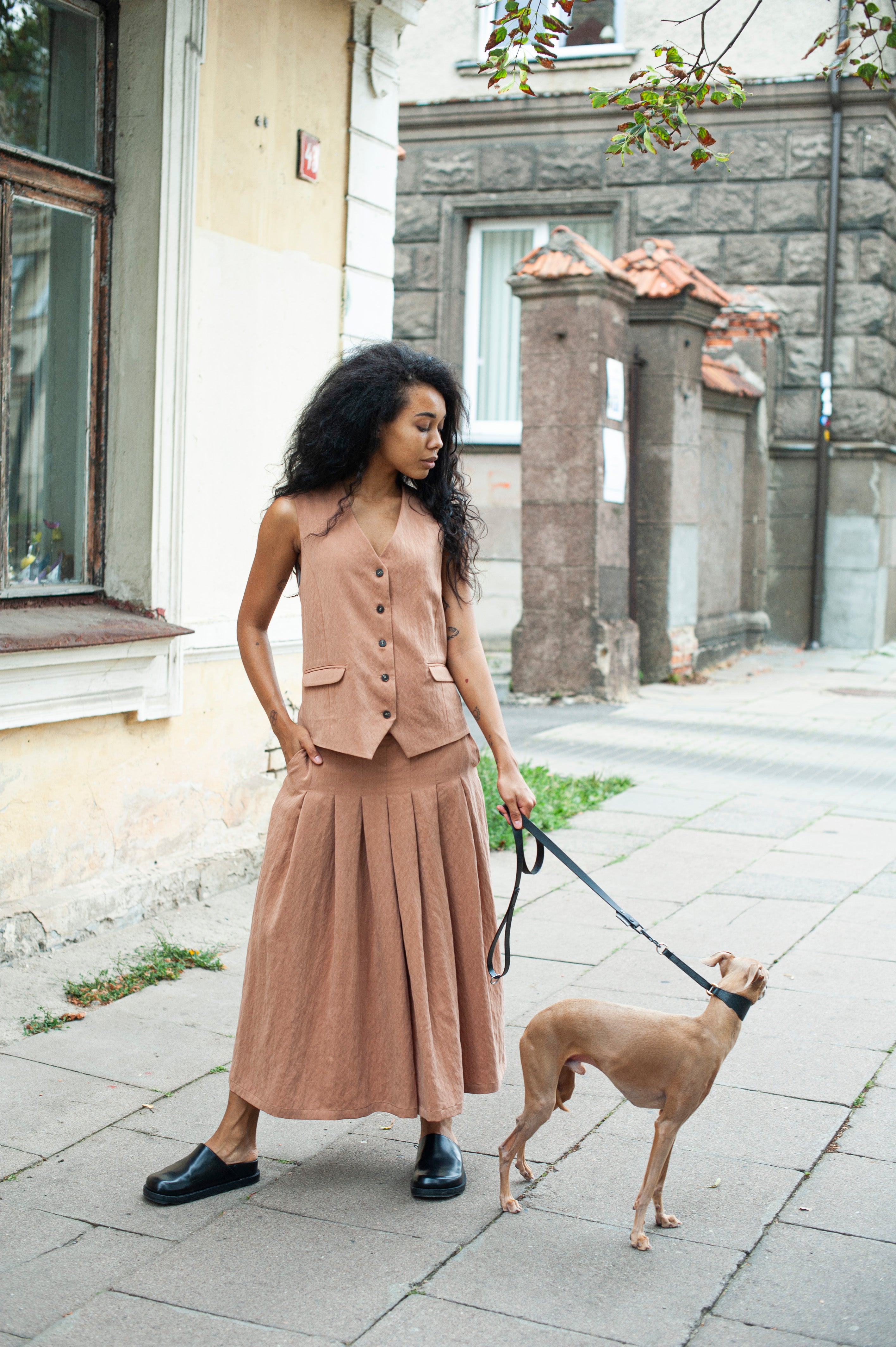 Wide-leg ankle length culottes paired with a matching linens suit vest.