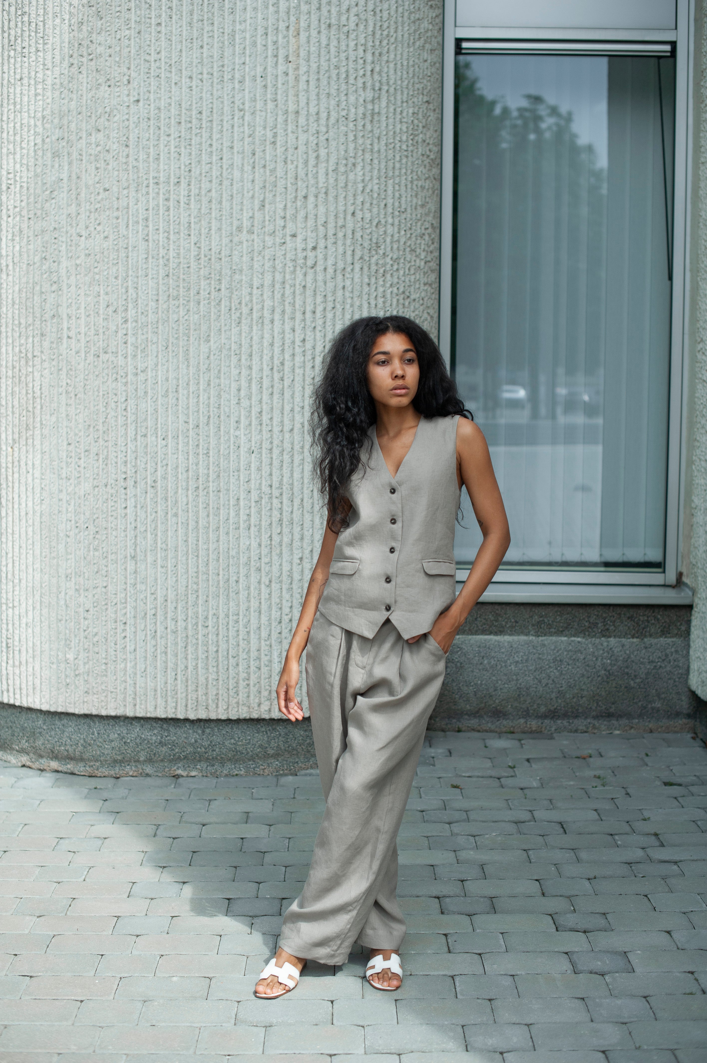 Light grey linen co-ord suit of a linen vest and wide-leg pants.