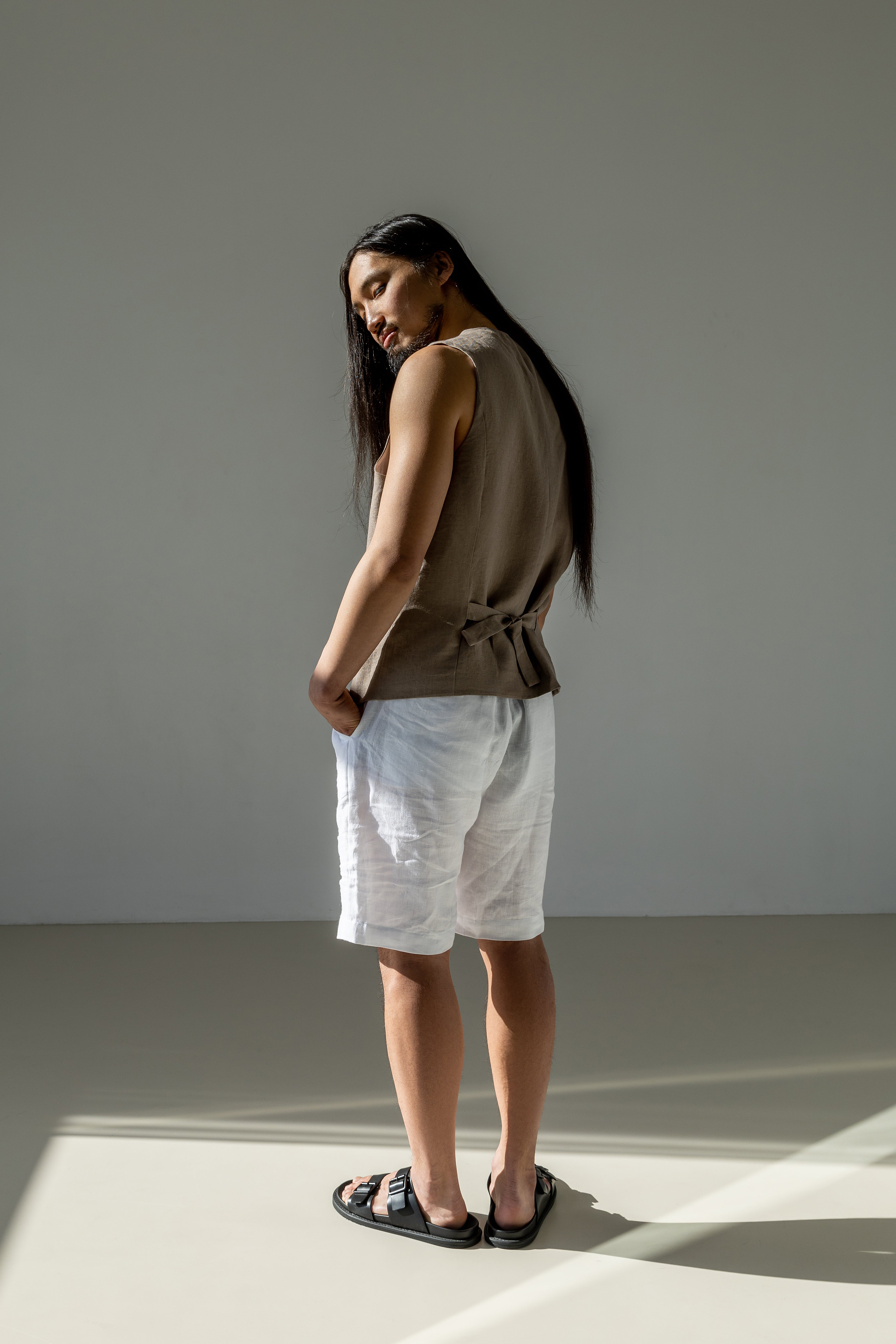 Men's linen waistcoat with a cinched back. Paired with white relaxed-fit linen shorts. Summer must-have in every man's wardrobe.
