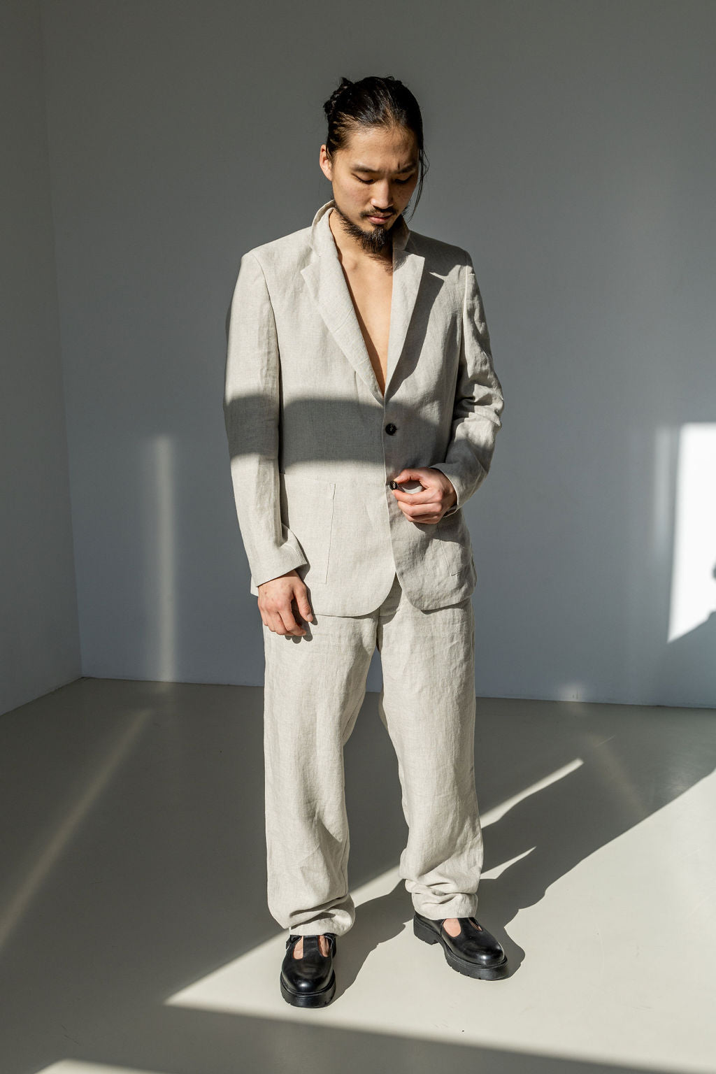 Natural linen suit for men. Single-breasted linen blazer and loose-fitting linen tapered pants.