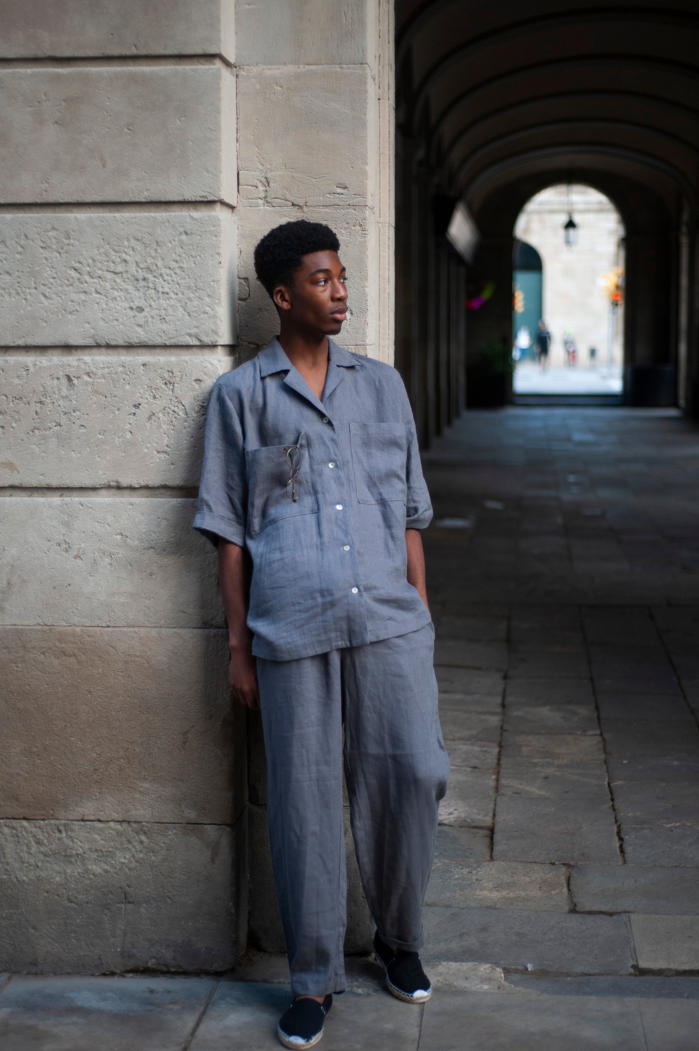 Loose-fit two piece linen set of a camp shirt and tapered leg loose fitting linen pants