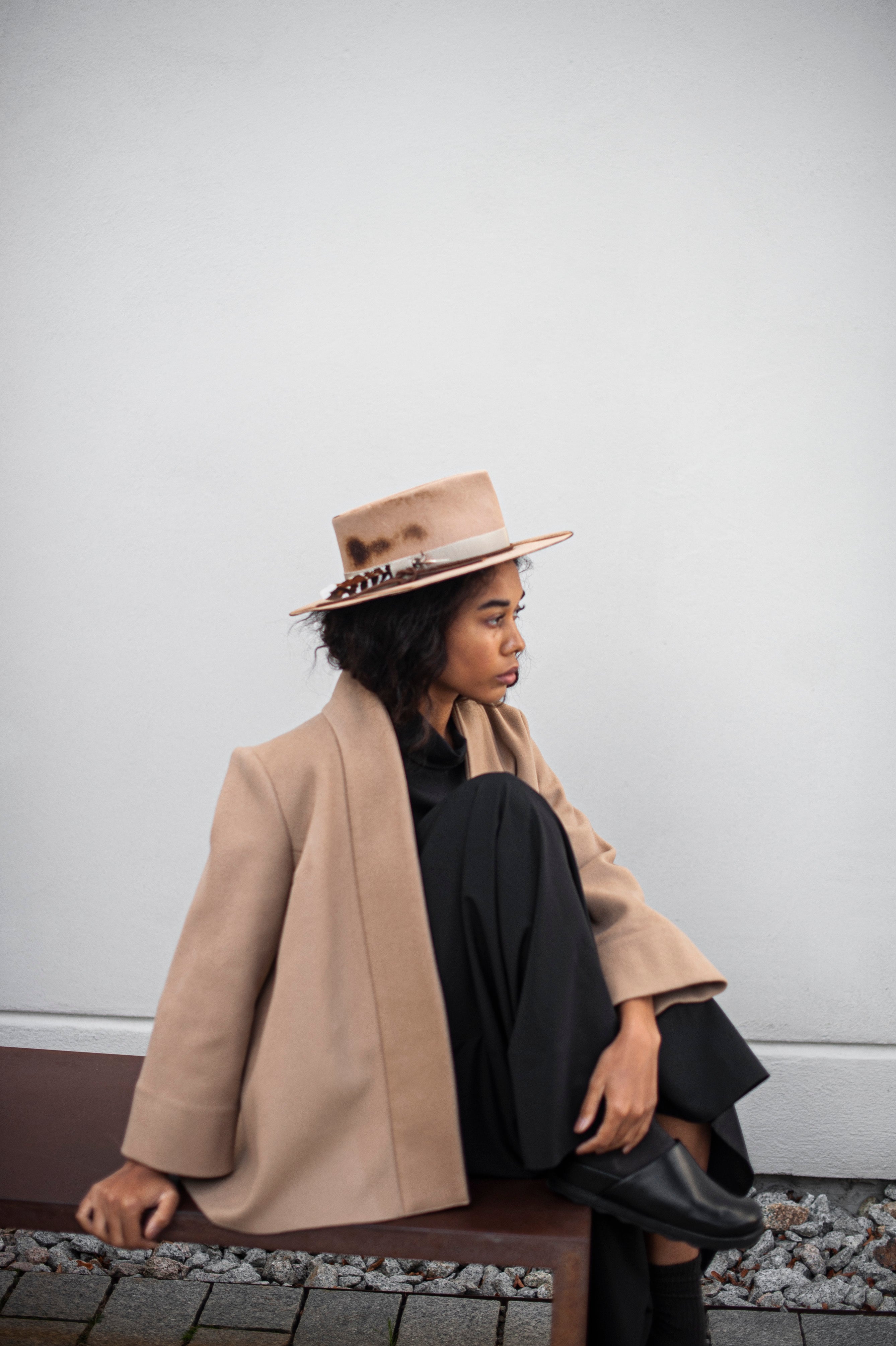 Elegant camel color wool blazer with an open front paired with a black co-ord set