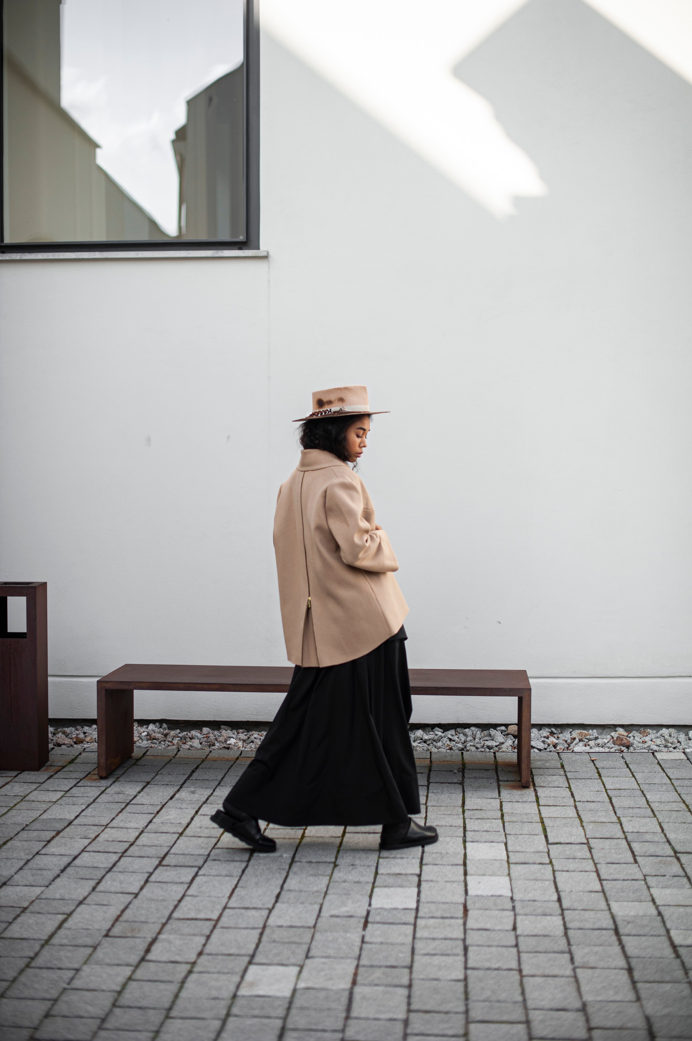 Minimalist wool jacket with a functional zipper detail in the back for more room.