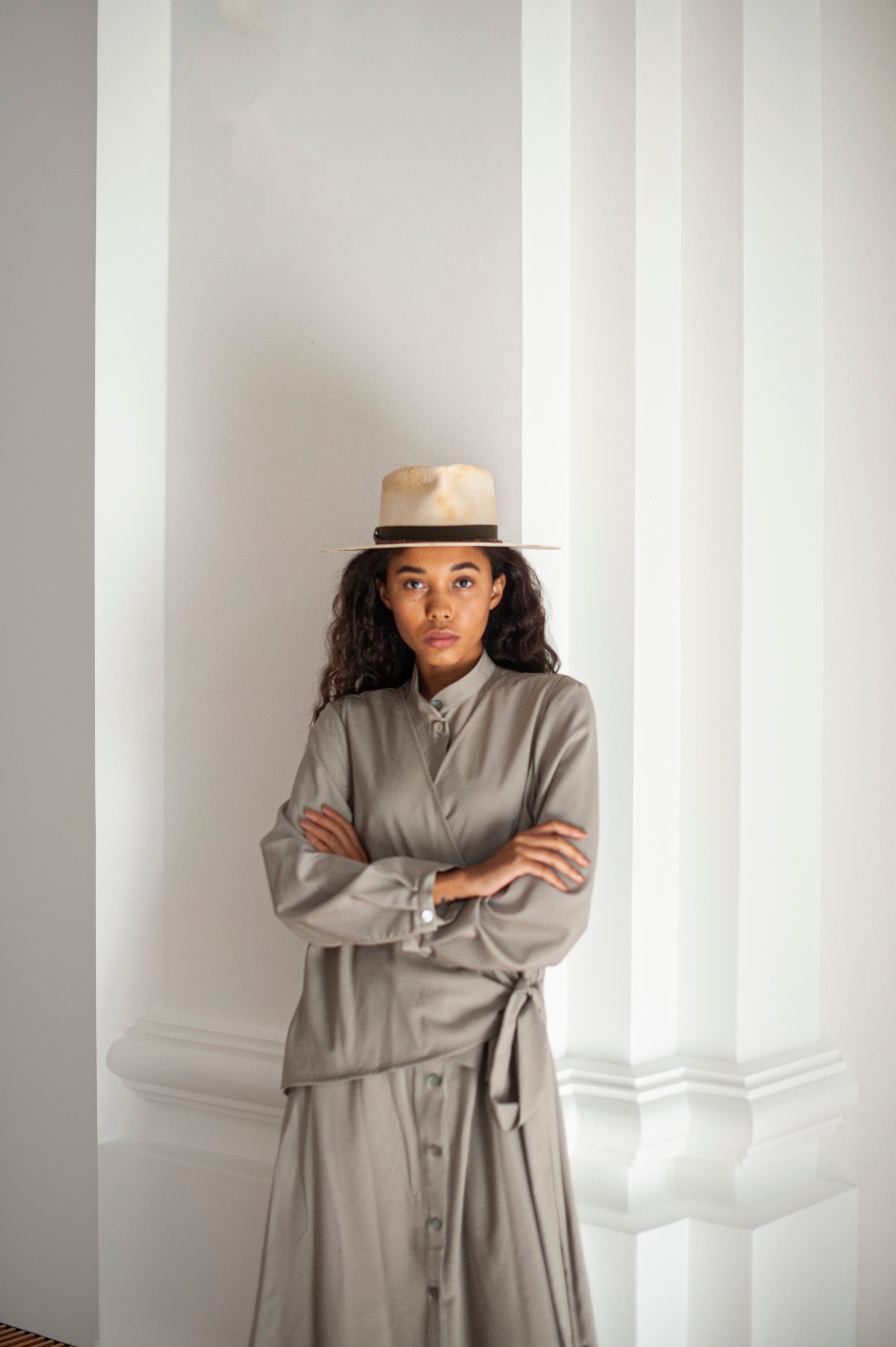 Elegant beige green dress in Merino wool. Button-up constructions, wrap construction in the front secured with long ties.