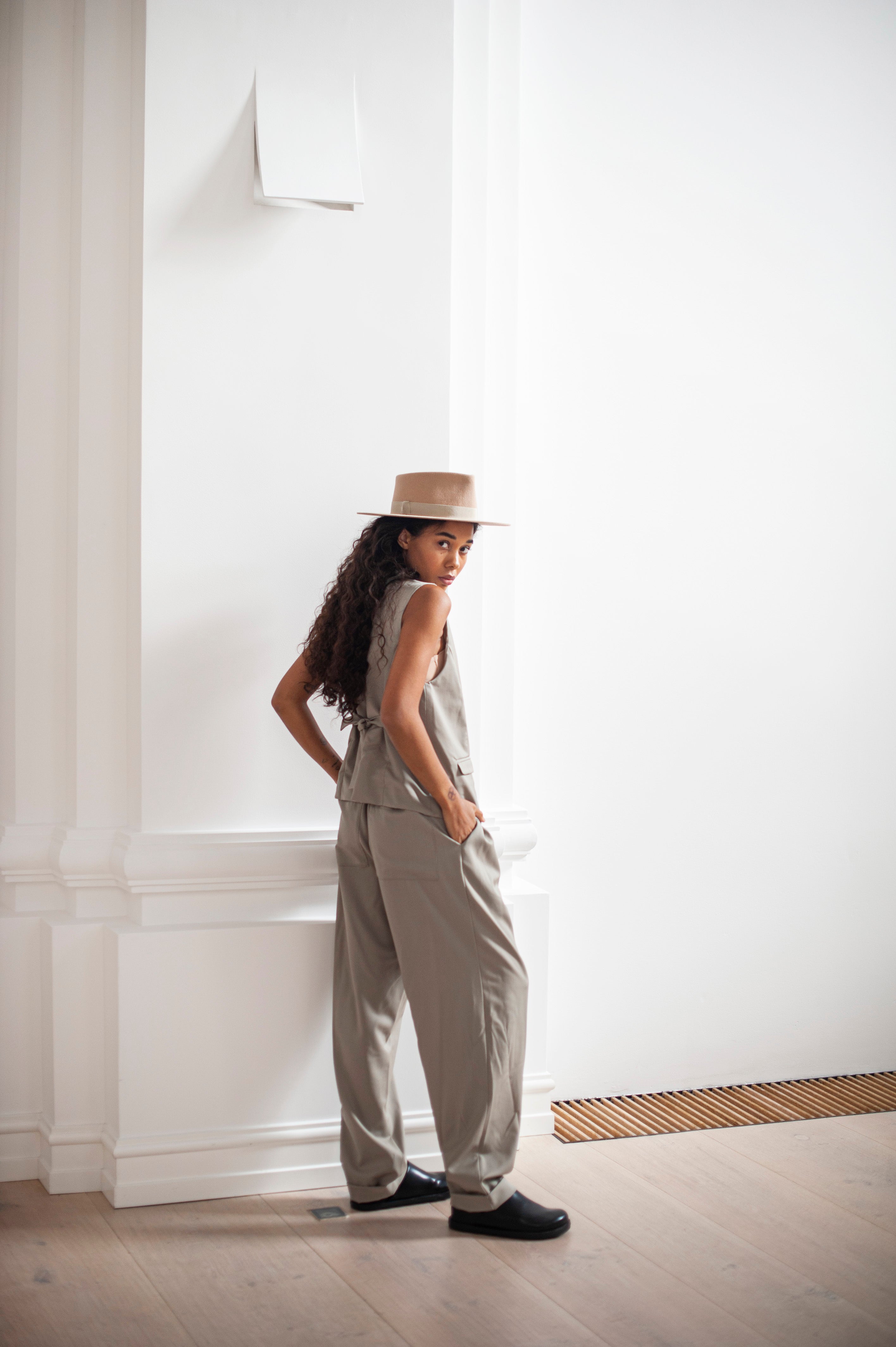A combo of a classic suit vest and banana trousers