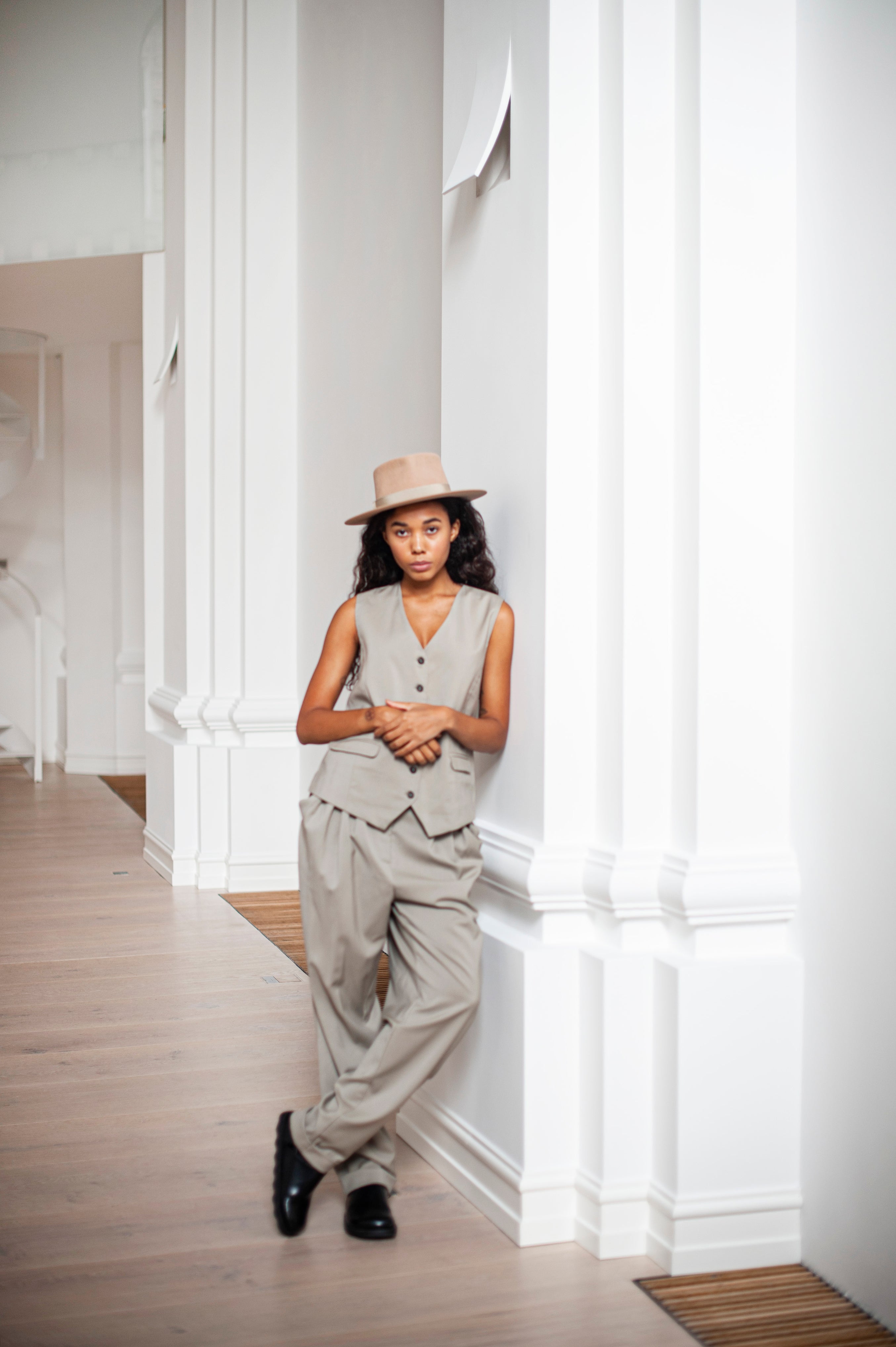 Green beige tapered-leg trousers paired with a matching waistcoat