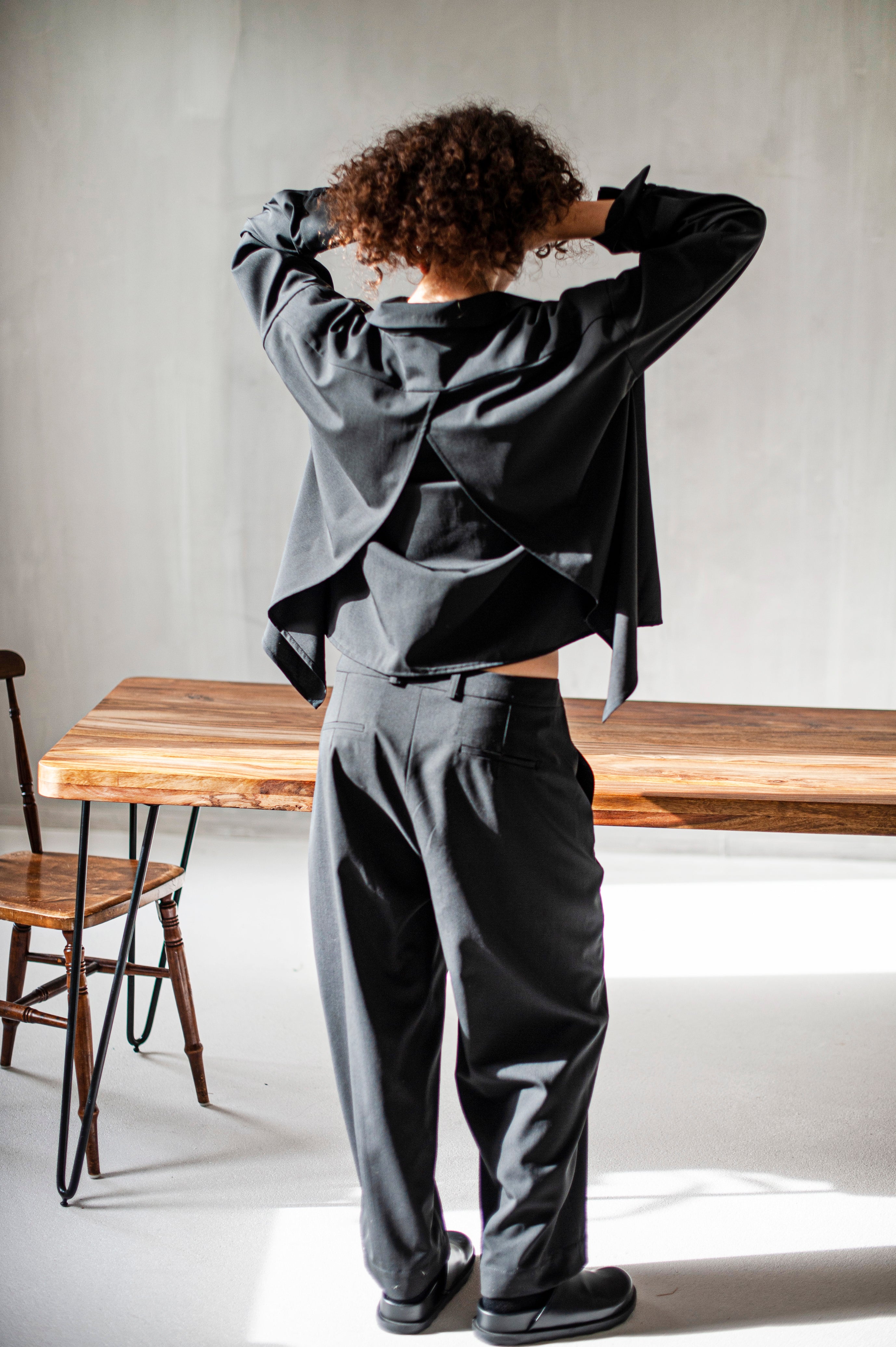 Black Merino wool shirt with a slit detail in the back.