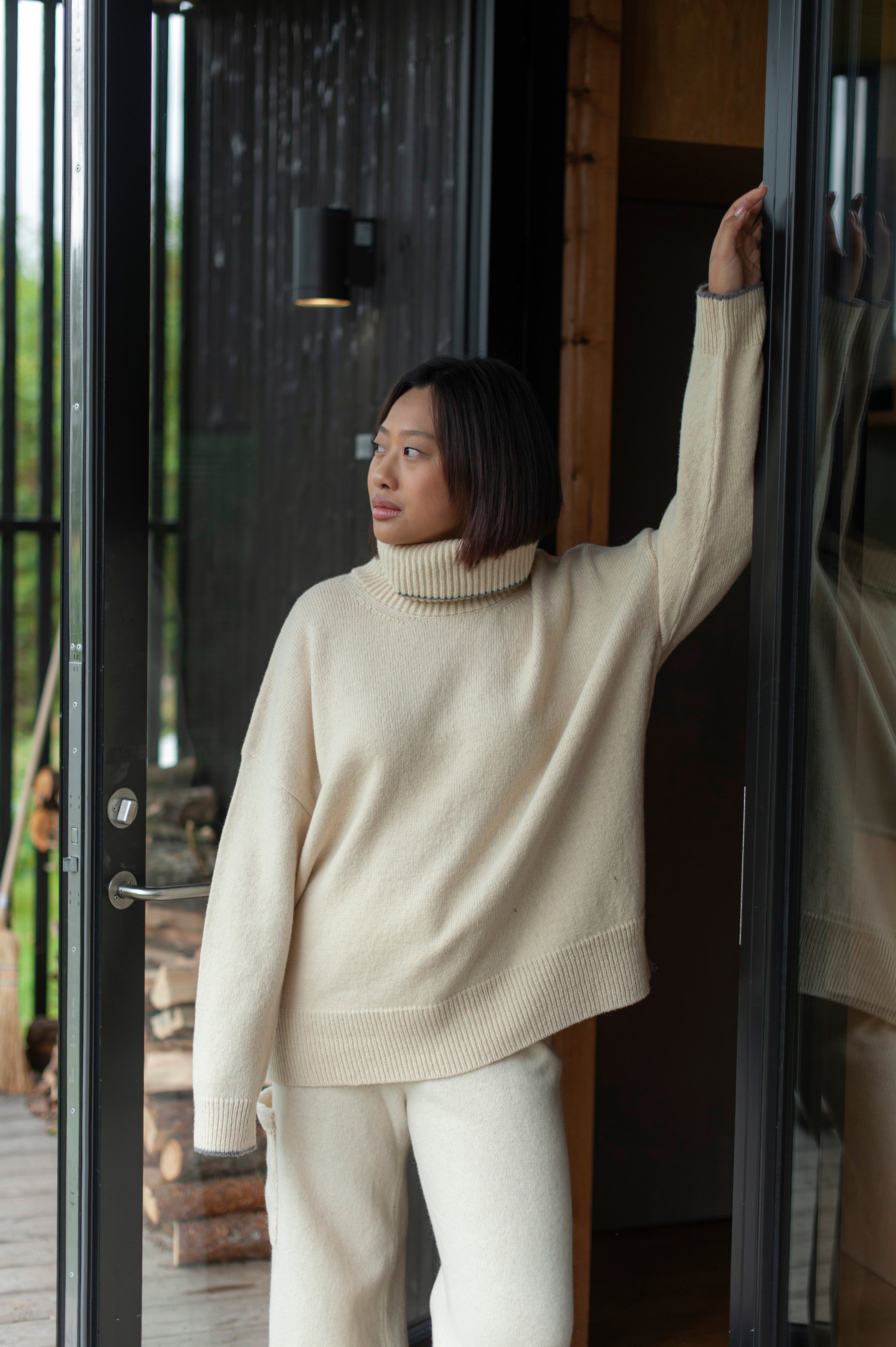 Minimalist merino wool high-neck sweater in an oversized fit.