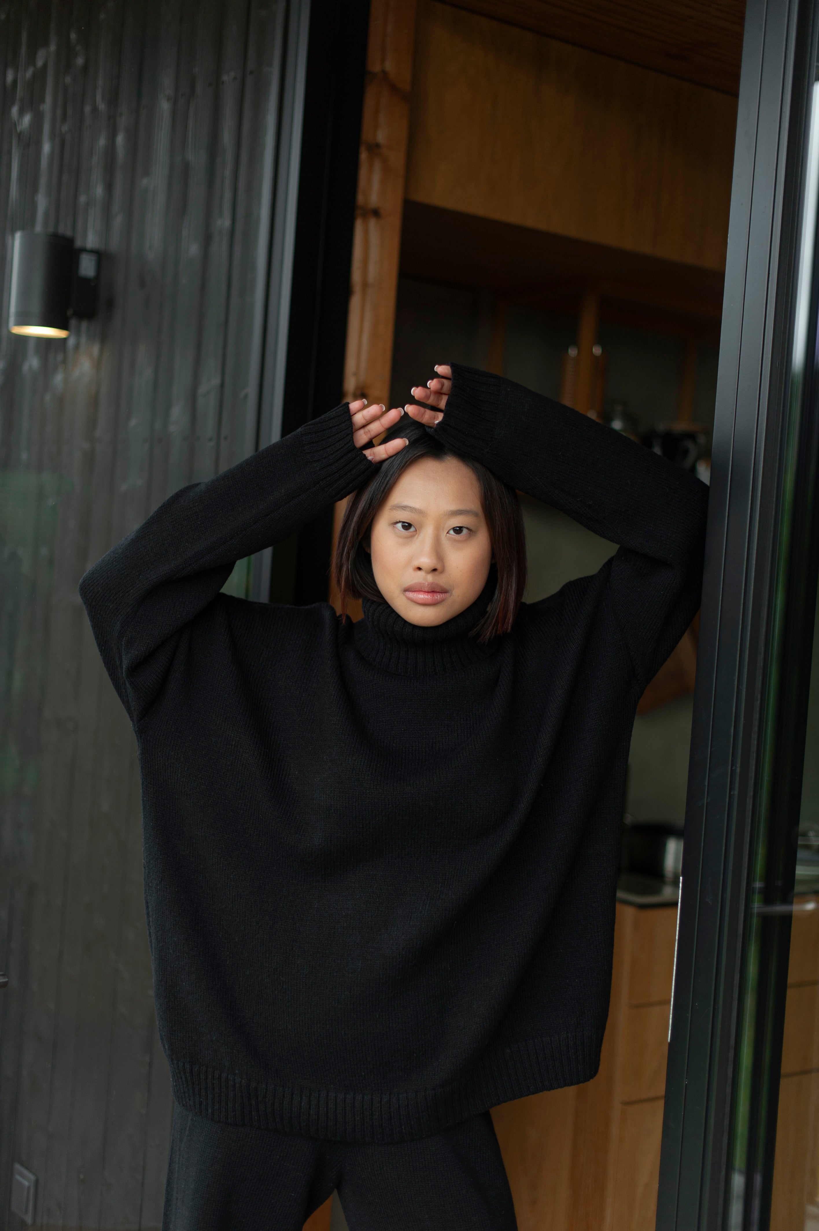 Oversized boxy fit black merino wool high-neck sweater