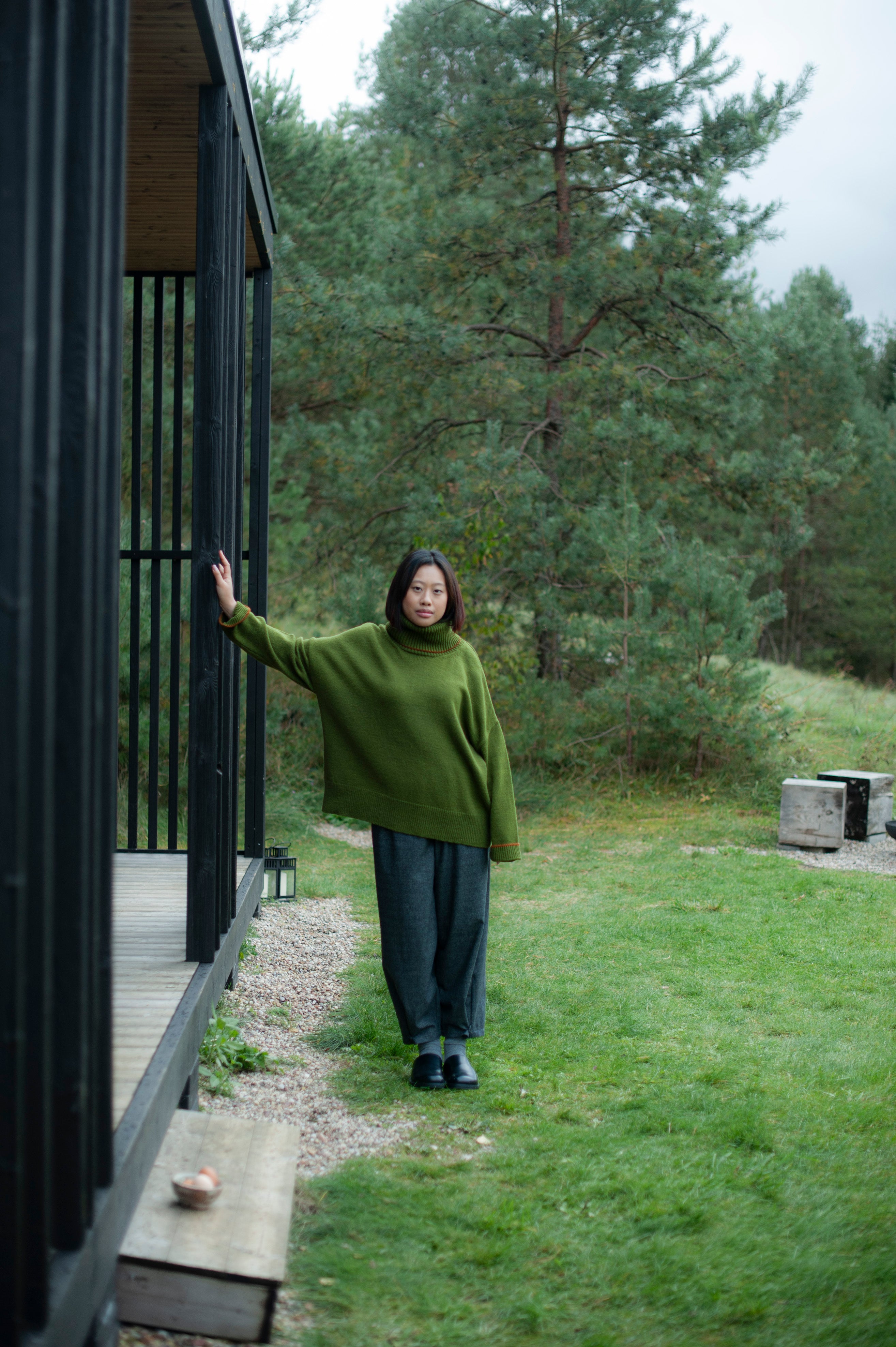 Knit green merino wool jumper and brown pants