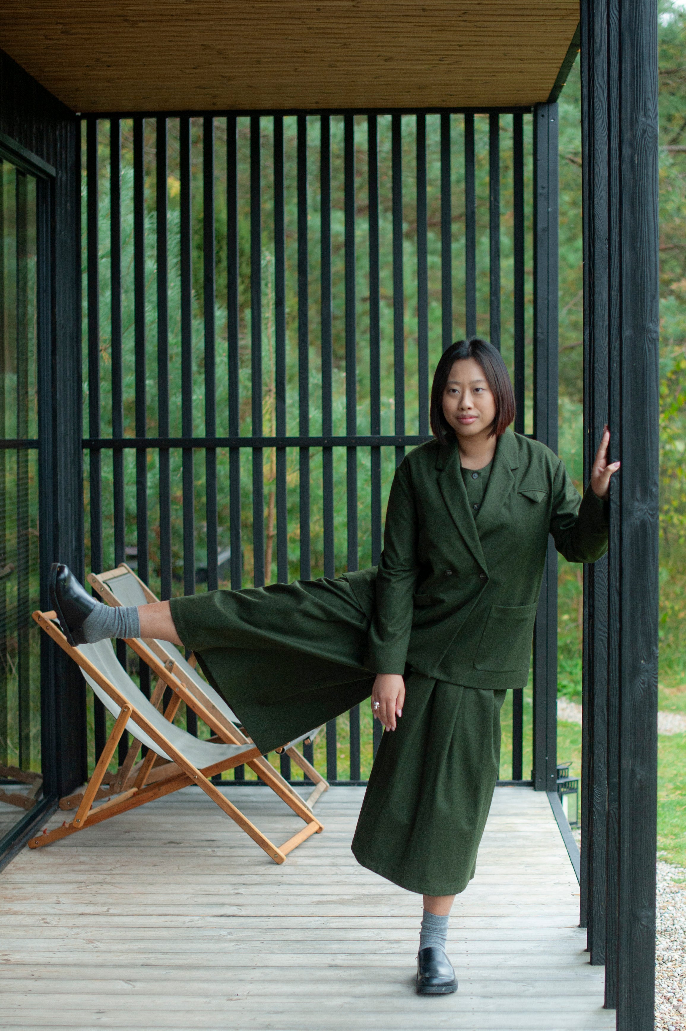 Mid-calf length culotte pants paired with a minimalist matching color double-breasted blazer with patch pockets.