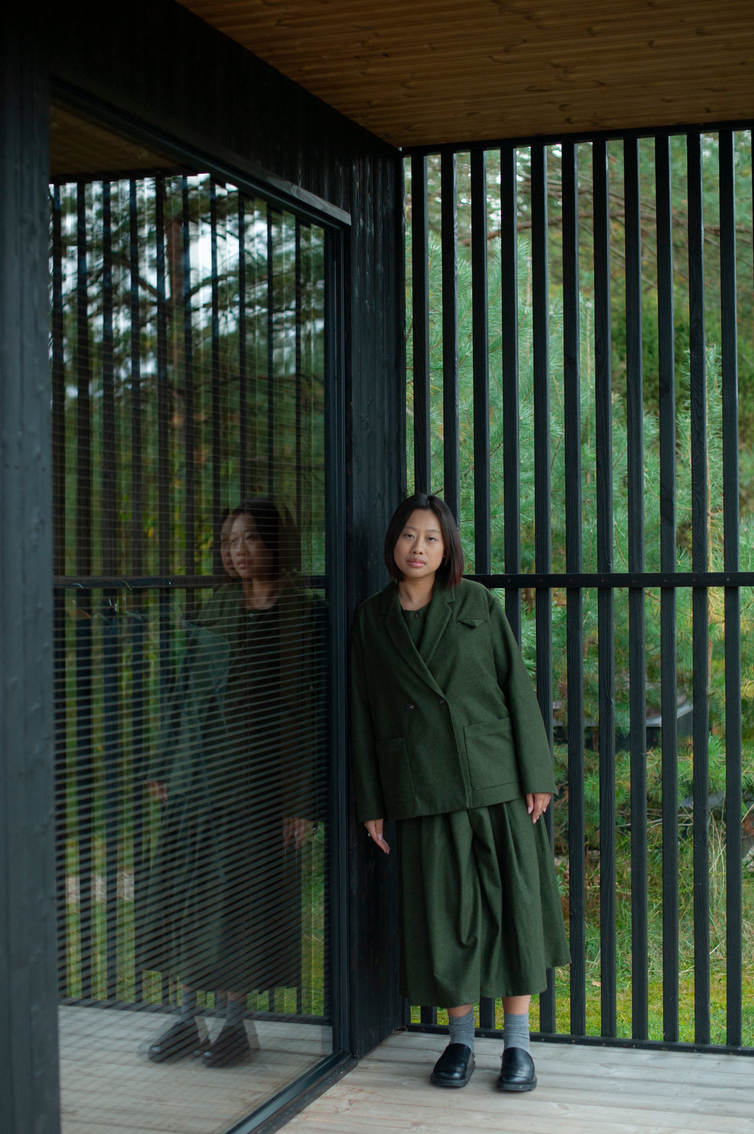 Mid-calf length culotte pants paired with a minimalist matching color button-up vest and double-breasted blazer.