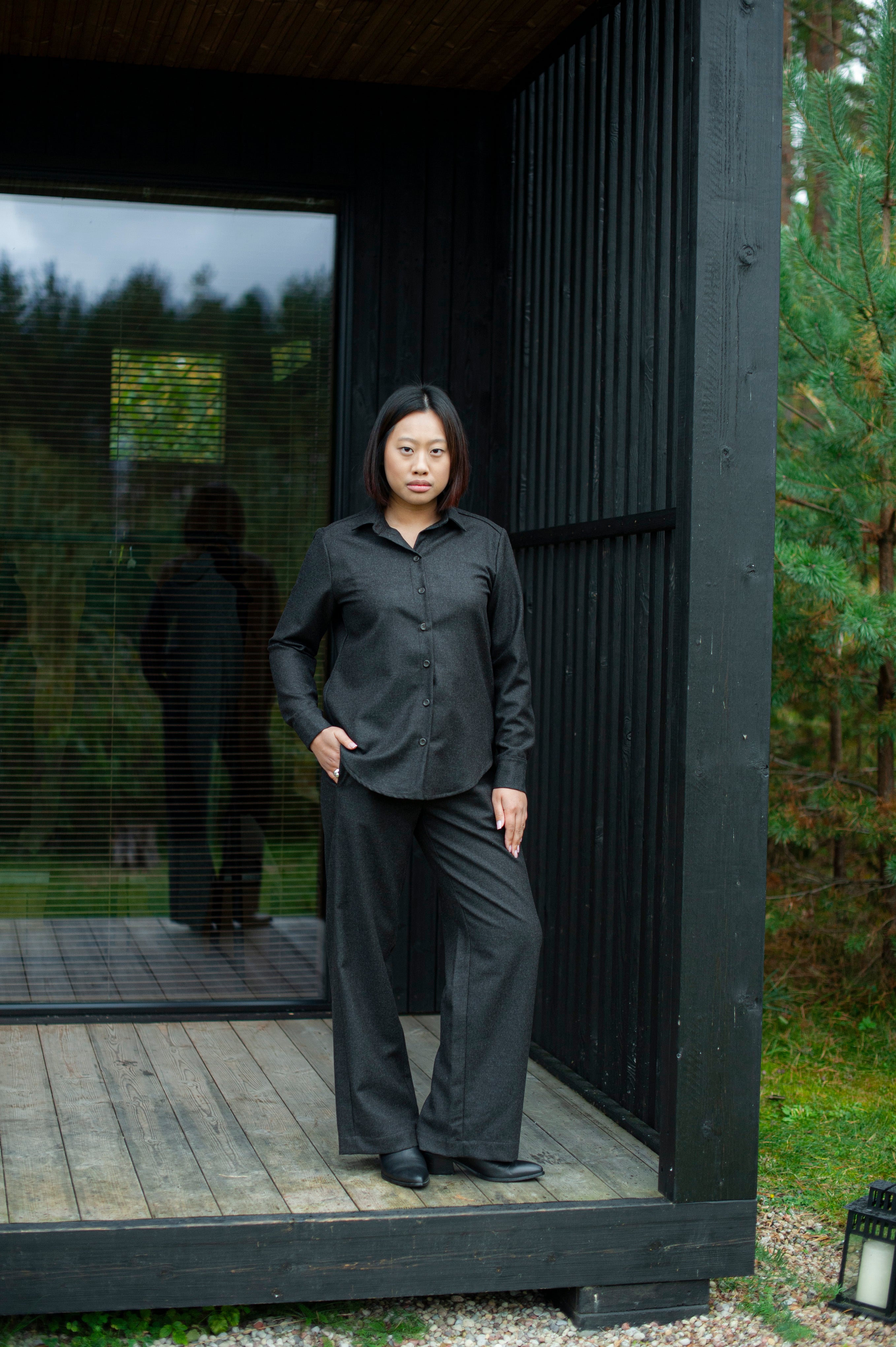 Women’s brown wool Oxford shirt with a relaxed straight fit and regular collar, paired with matching brown straight-leg pants for a minimalist, elegant look.