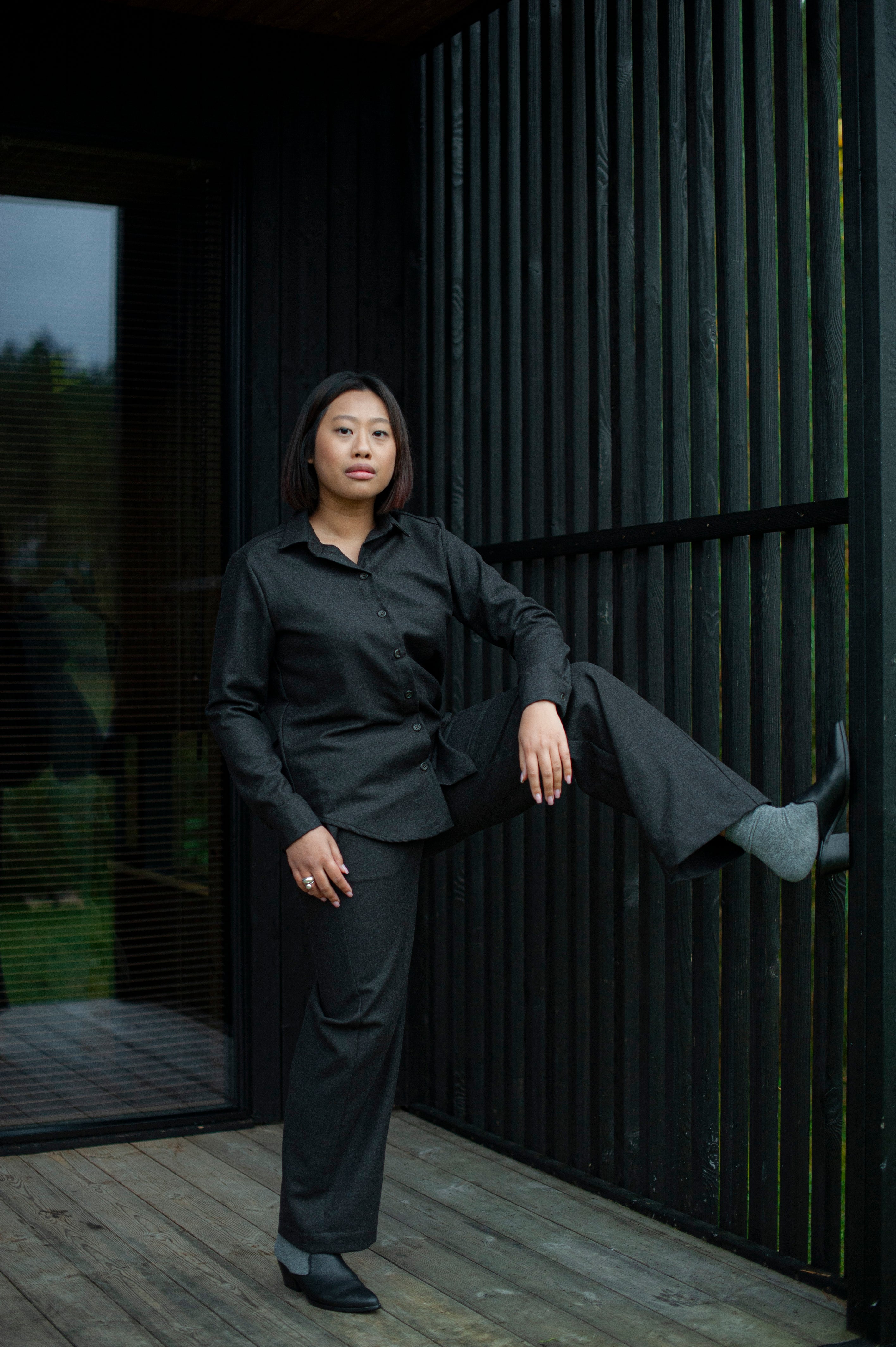 Women’s brown wool Oxford shirt with a relaxed straight fit and regular collar, paired with matching brown straight-leg pants for a minimalist, elegant look.