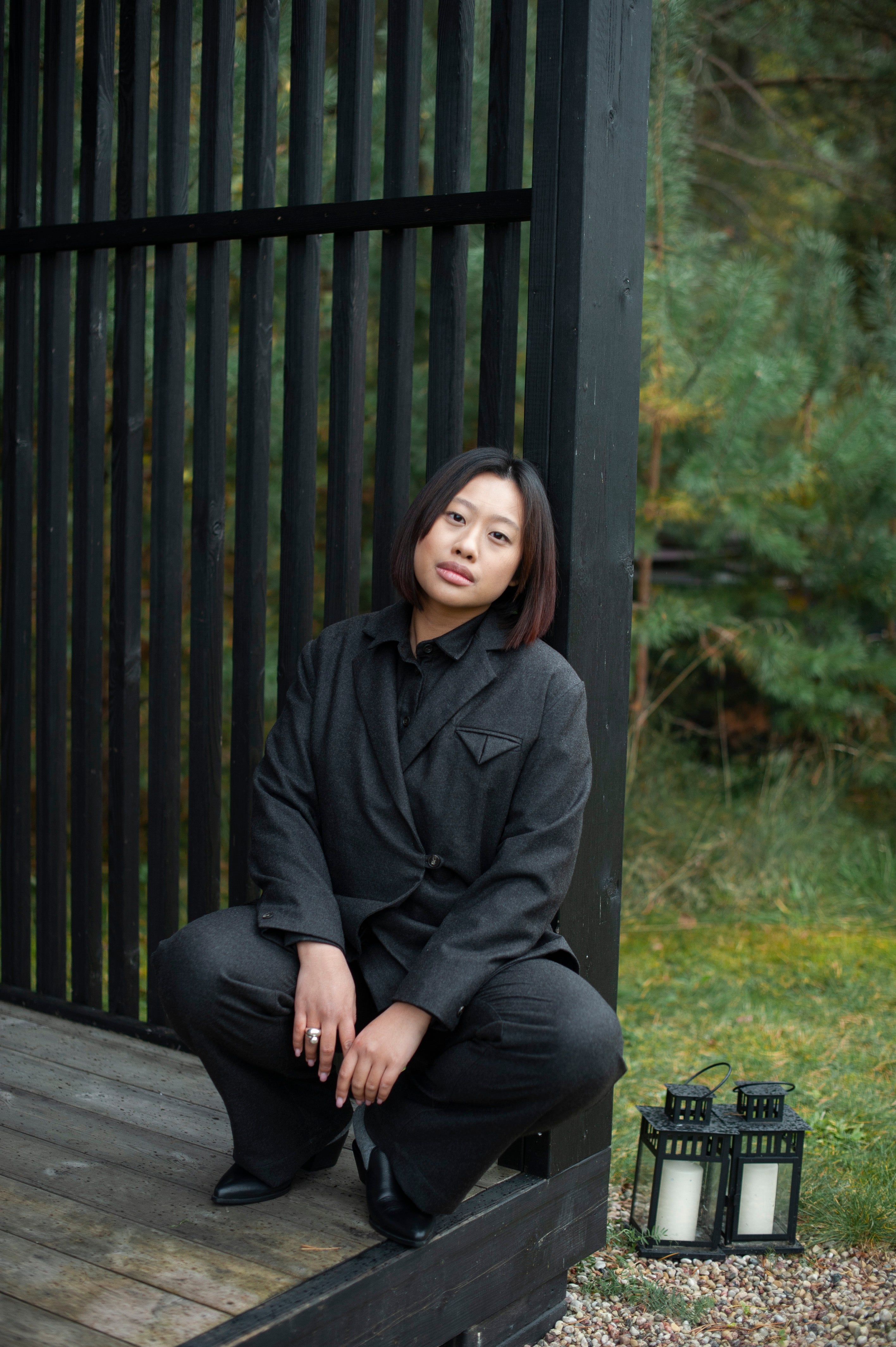 Women's brown single-breasted boxy fit blazer paired with matching pants.