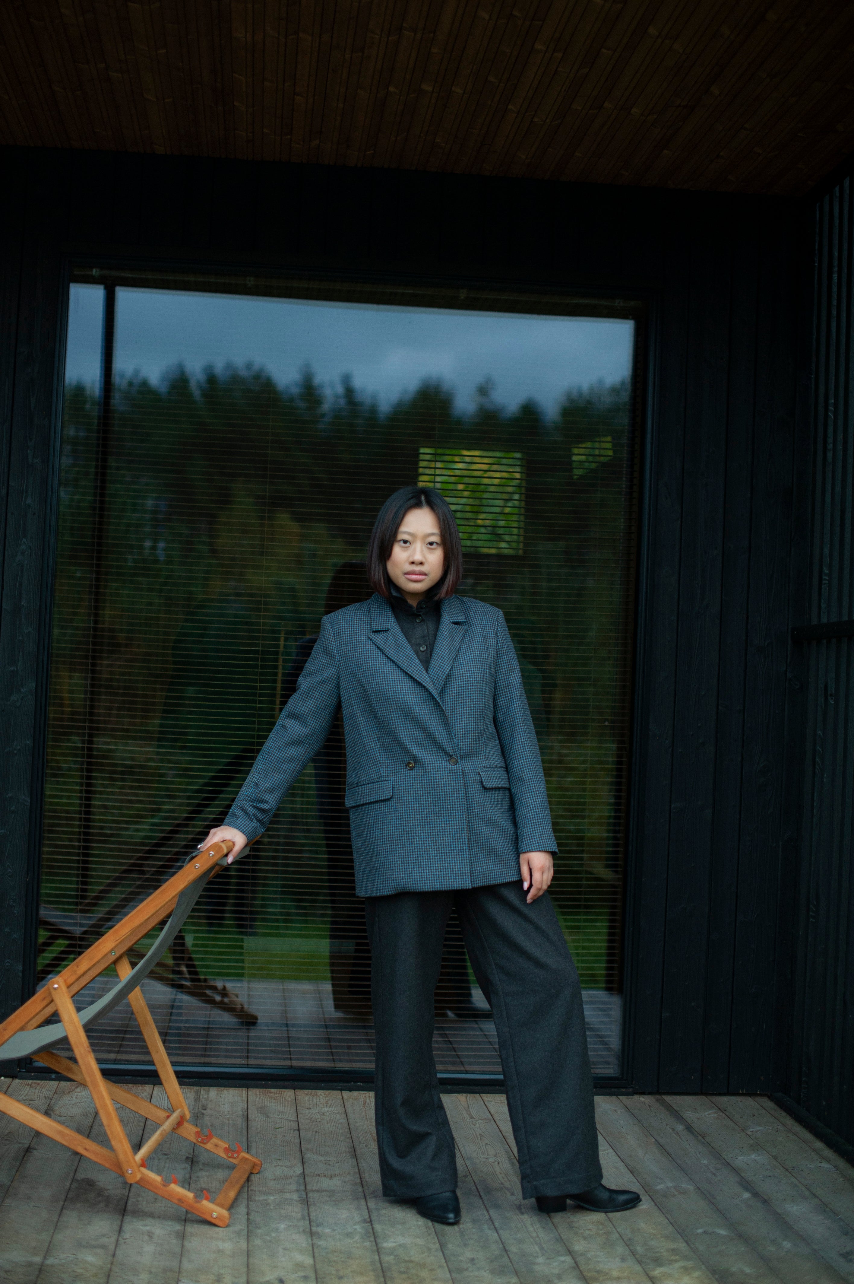 Elegant contemporary regular fit blue checked wool blazer with a double-breasted closure. Fully lined, lightweight, and cozy, it is a perfect go-to for an elevated office outfit or any other formal occasions when you need to look put-together.