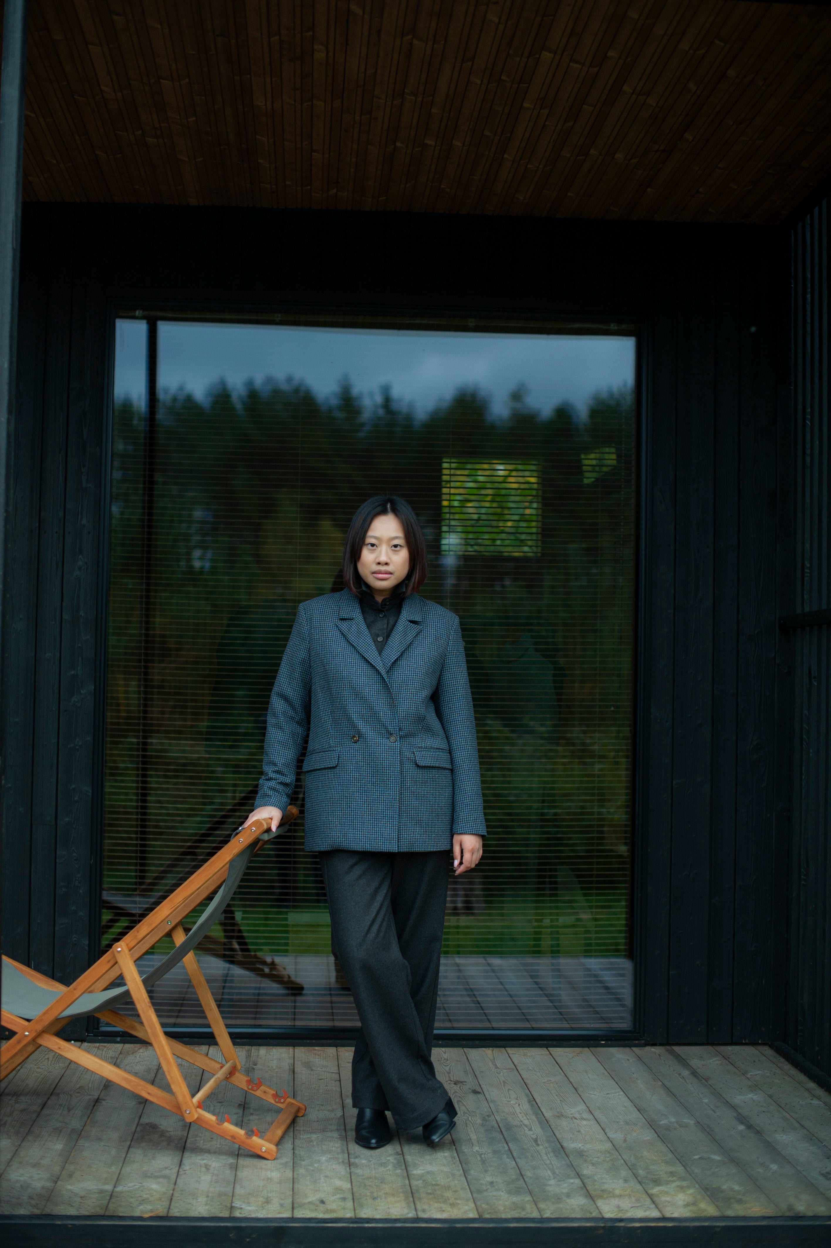 Elegant contemporary regular fit blue checked wool blazer with a double-breasted closure. Fully lined, lightweight, and cozy, it is a perfect go-to for an elevated office outfit or any other formal occasions when you need to look put-together.
