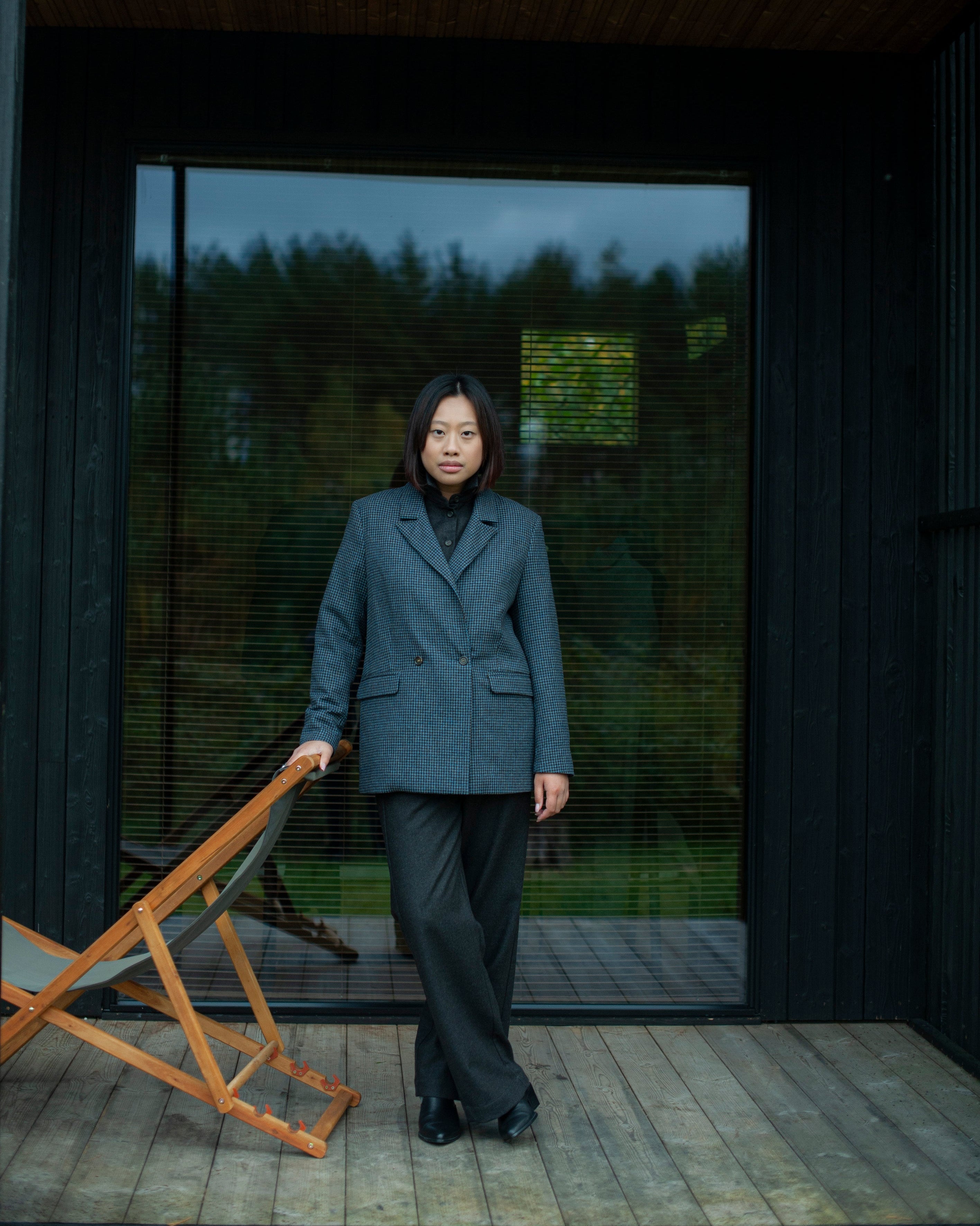 Elegant contemporary regular fit blue checked wool blazer with a double-breasted closure. Fully lined, lightweight, and cozy, it is a perfect go-to for an elevated office outfit or any other formal occasions when you need to look put-together.
