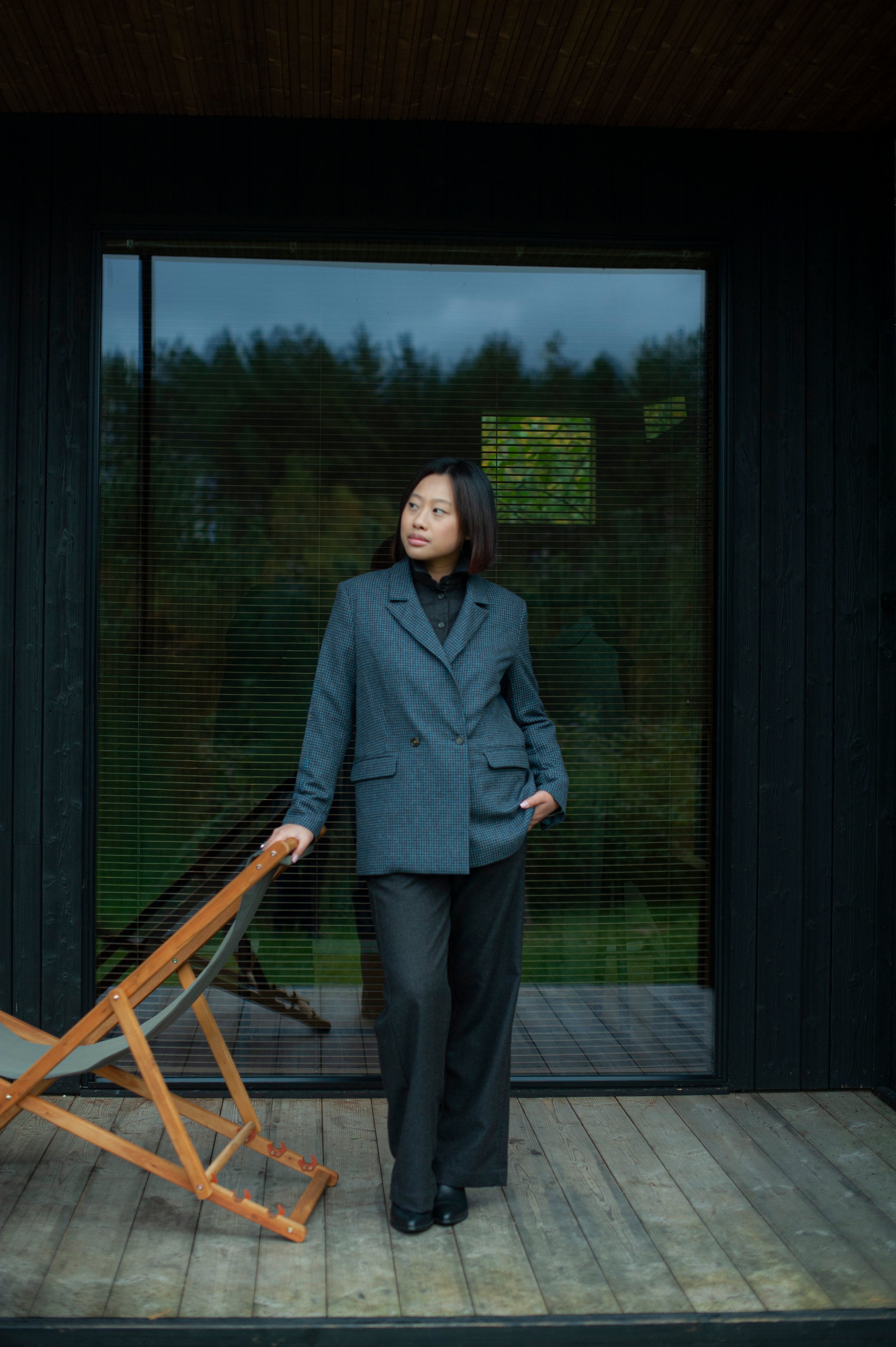 Elegant contemporary regular fit blue checked wool blazer with a double-breasted closure. Fully lined, lightweight, and cozy, it is a perfect go-to for an elevated office outfit or any other formal occasions when you need to look put-together.