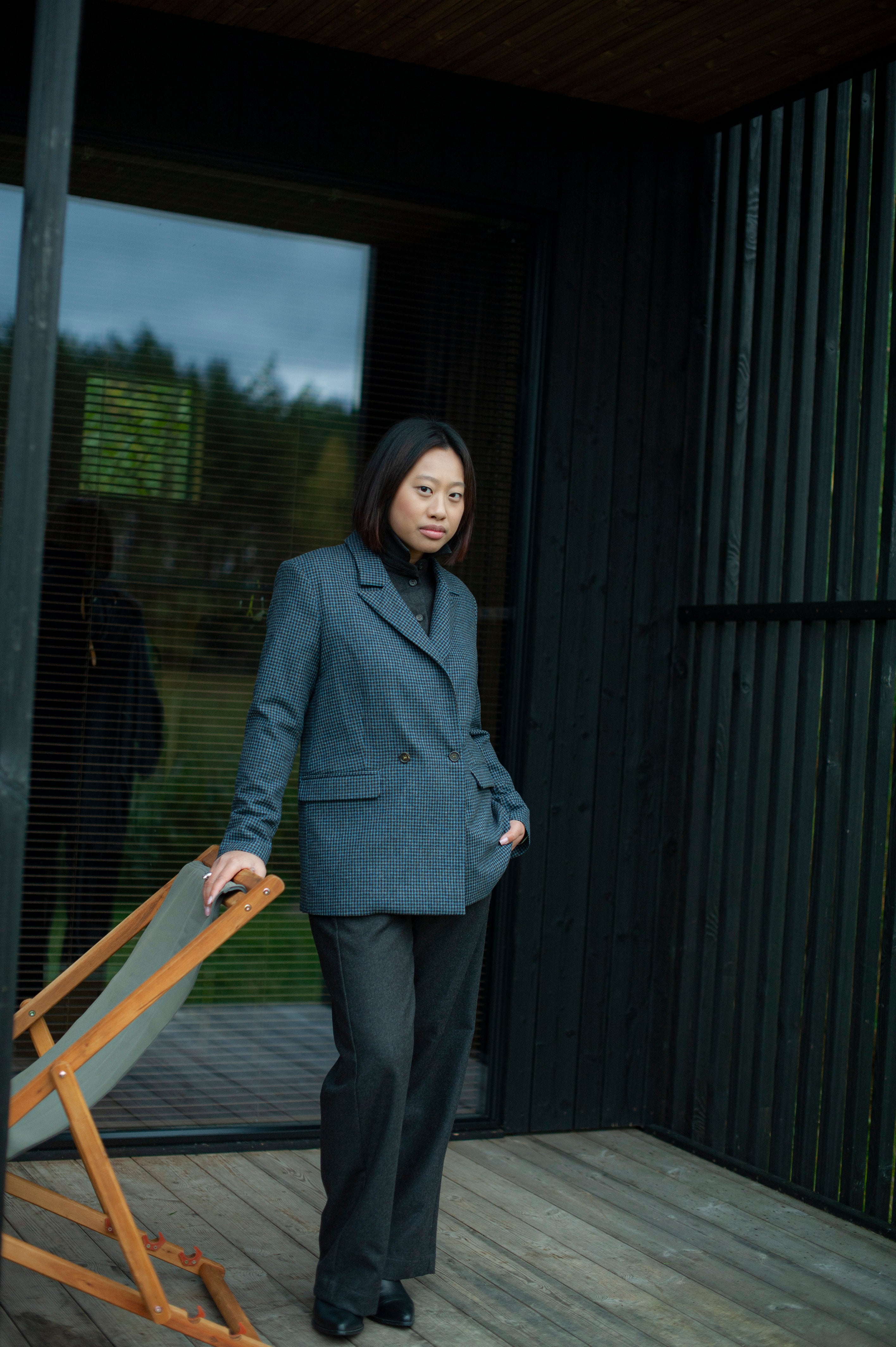 Elegant contemporary regular fit blue checked wool blazer with a double-breasted closure. Fully lined, lightweight, and cozy, it is a perfect go-to for an elevated office outfit or any other formal occasions when you need to look put-together.