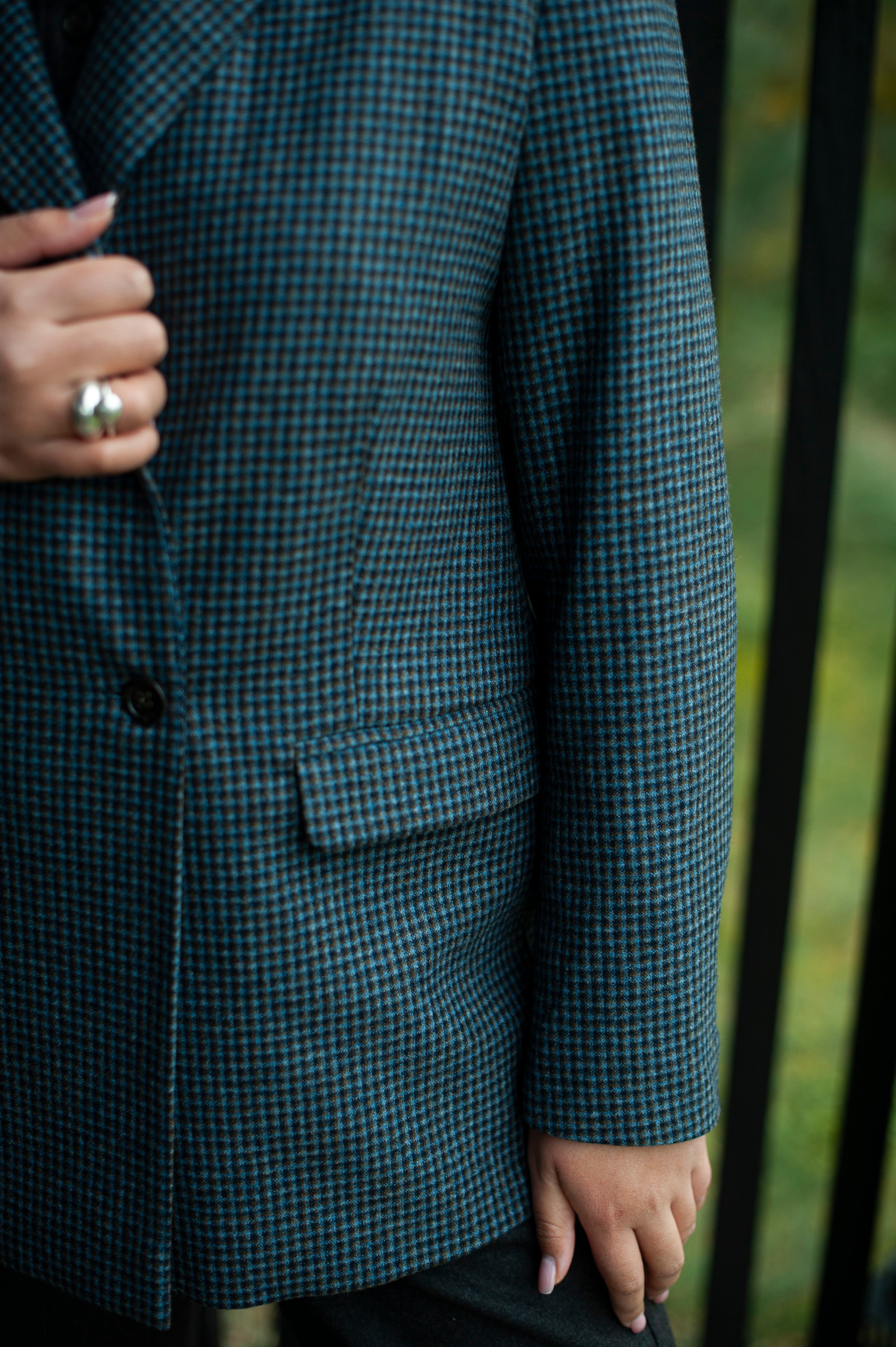 The front details of the blue checked single breasted blazer