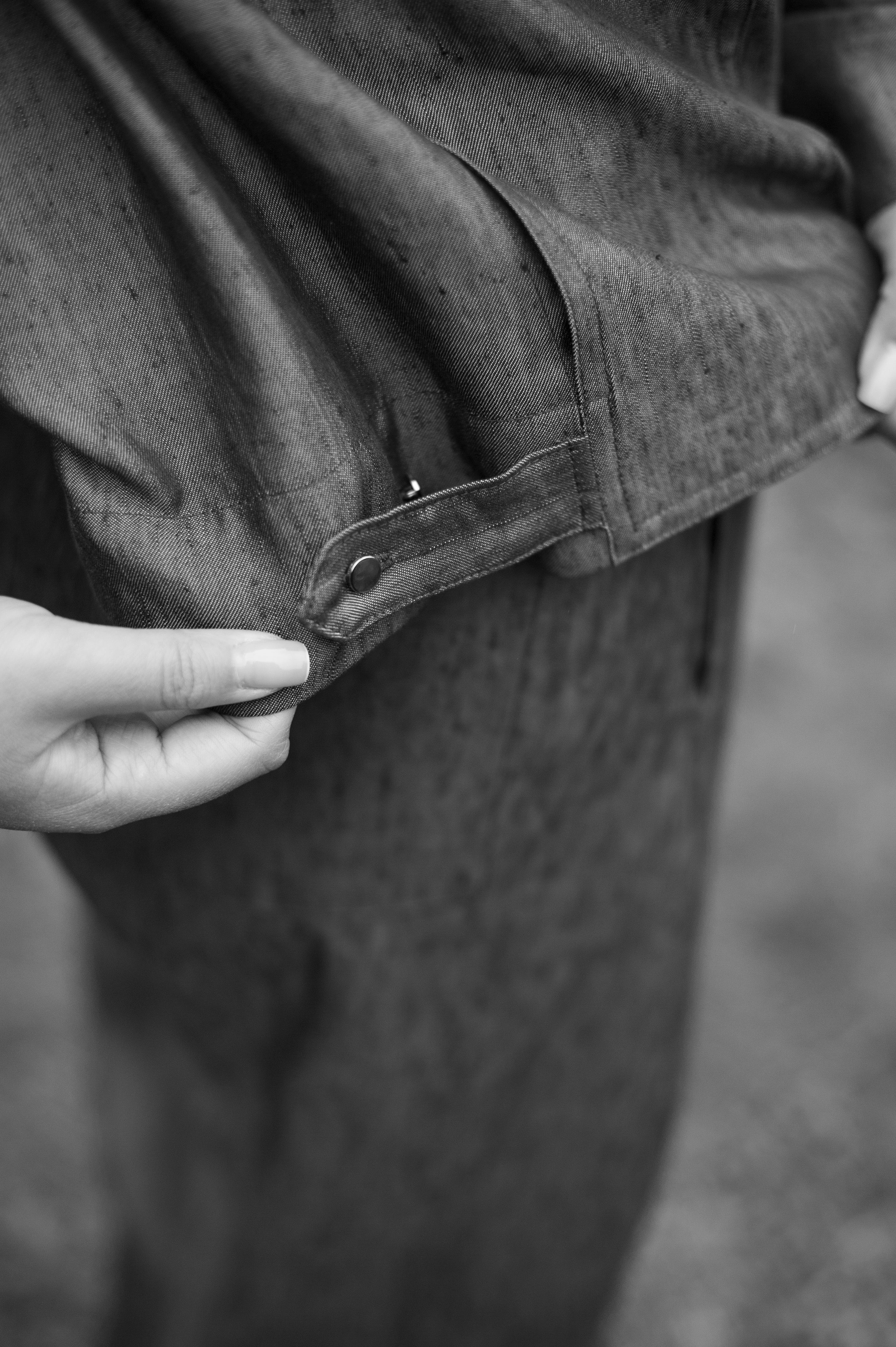 Denim blue linen button-up shirt with matching tapered leg pleated pants.