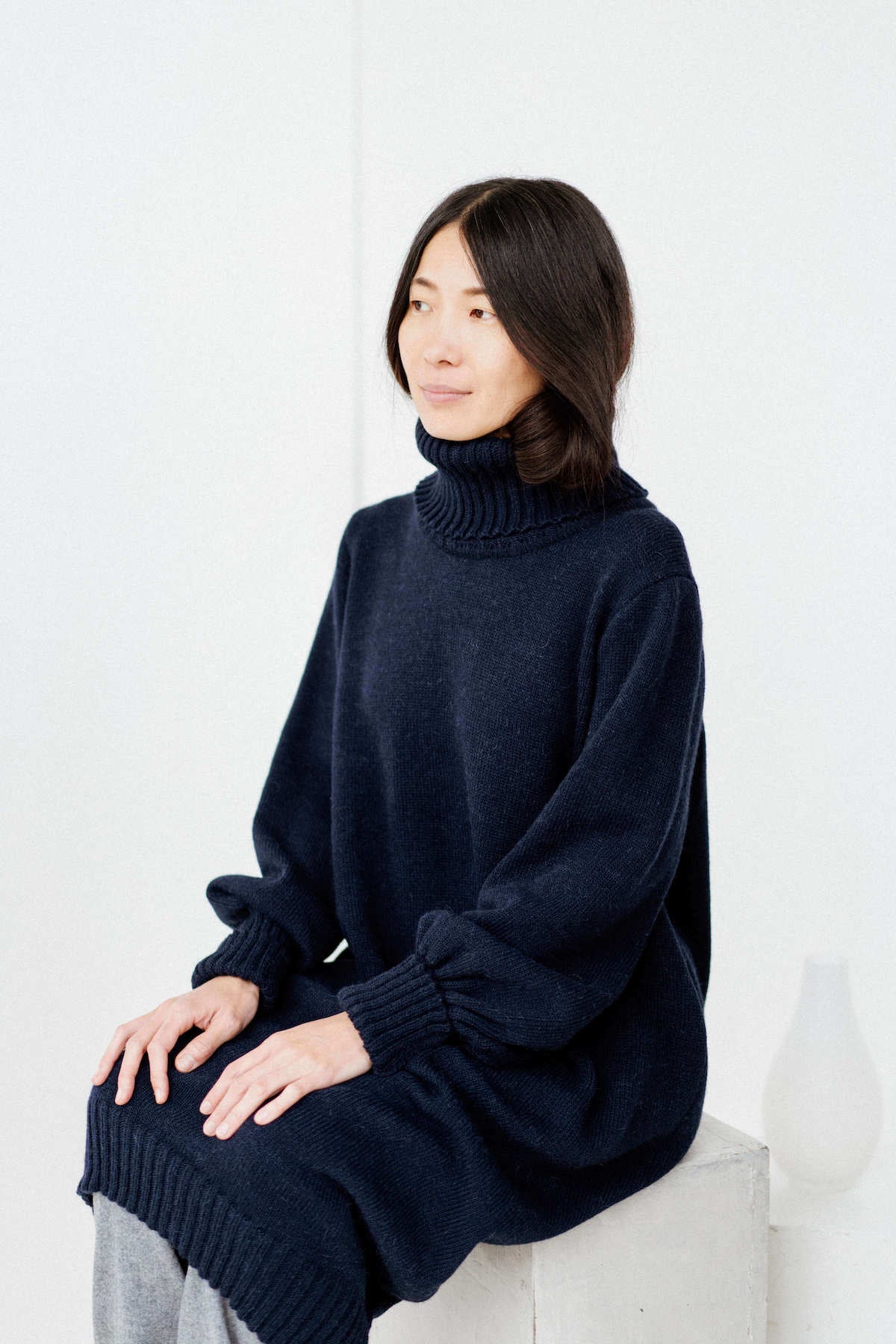 Black merino wool knitted dress with puffed sleeves HARUTO