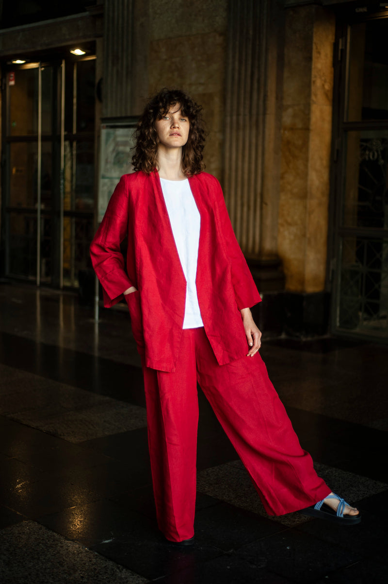 Women's red linen blazer, red linen pants, and a white linen blouse. Your must-have summer ensemble.