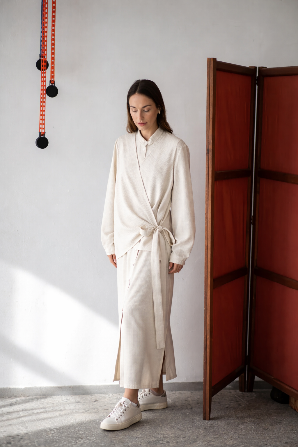 Long sleeve button-up wool dress with wrap vest detail
