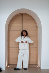 Wide-leg pants and a collar jacket in white pinstripe