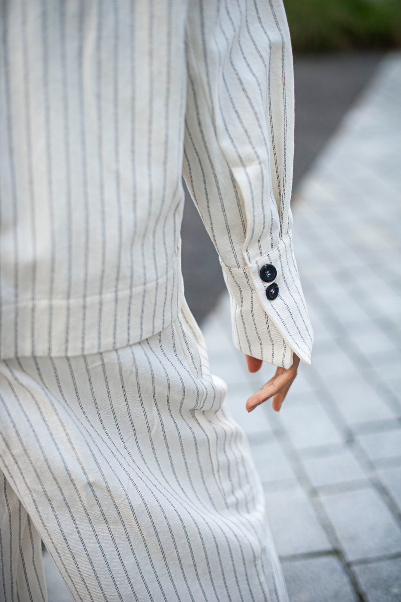 White organic cotton fabric with stripes. Minimalist one-size jacket with French cuffs