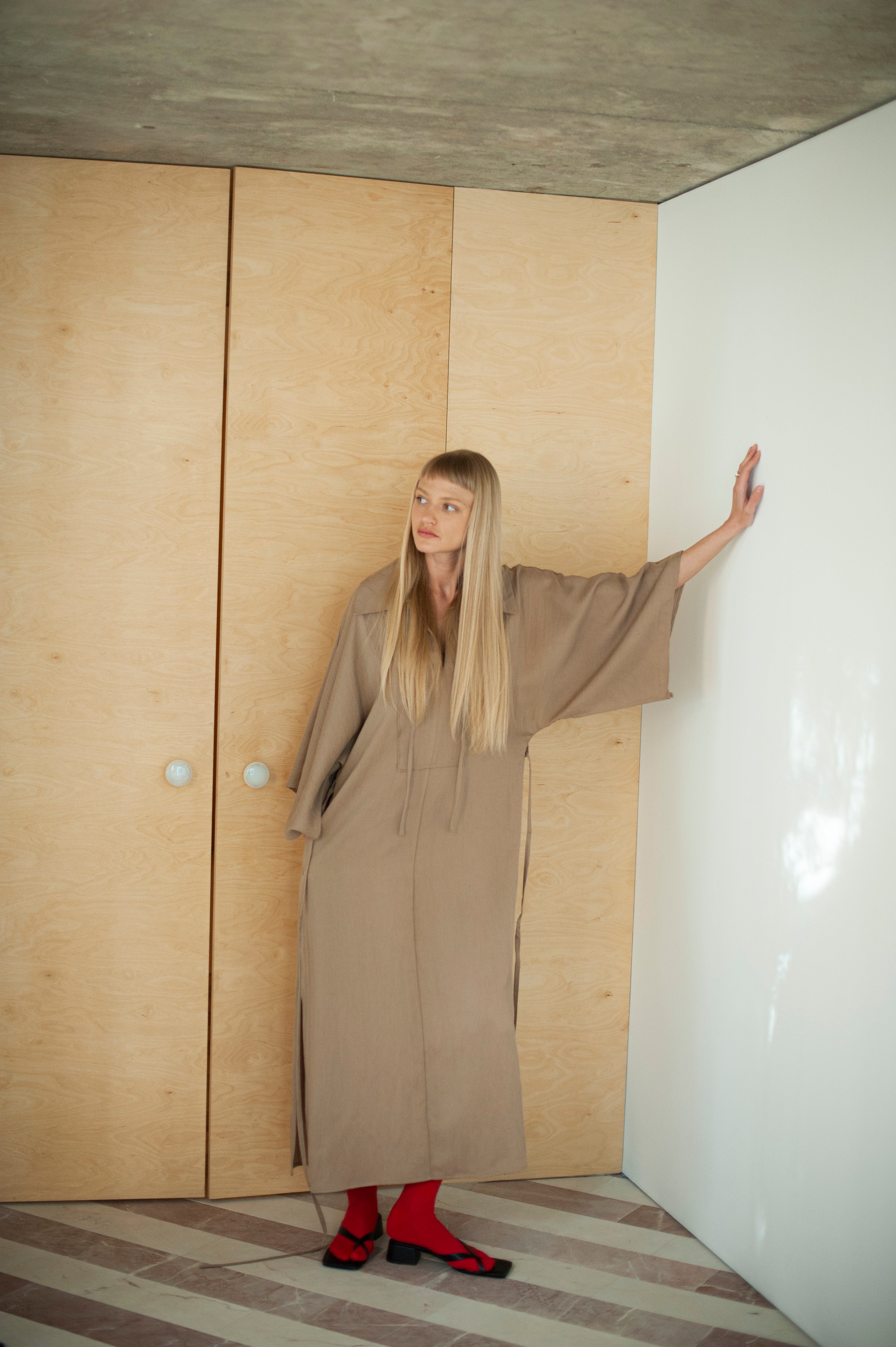 Sand beige dress rayon dress. The dress features wide kimono-style inspired sleeves, a large shirt collar and side slits on sleeves and hem. Long and slim waist tie for a more better balance look.