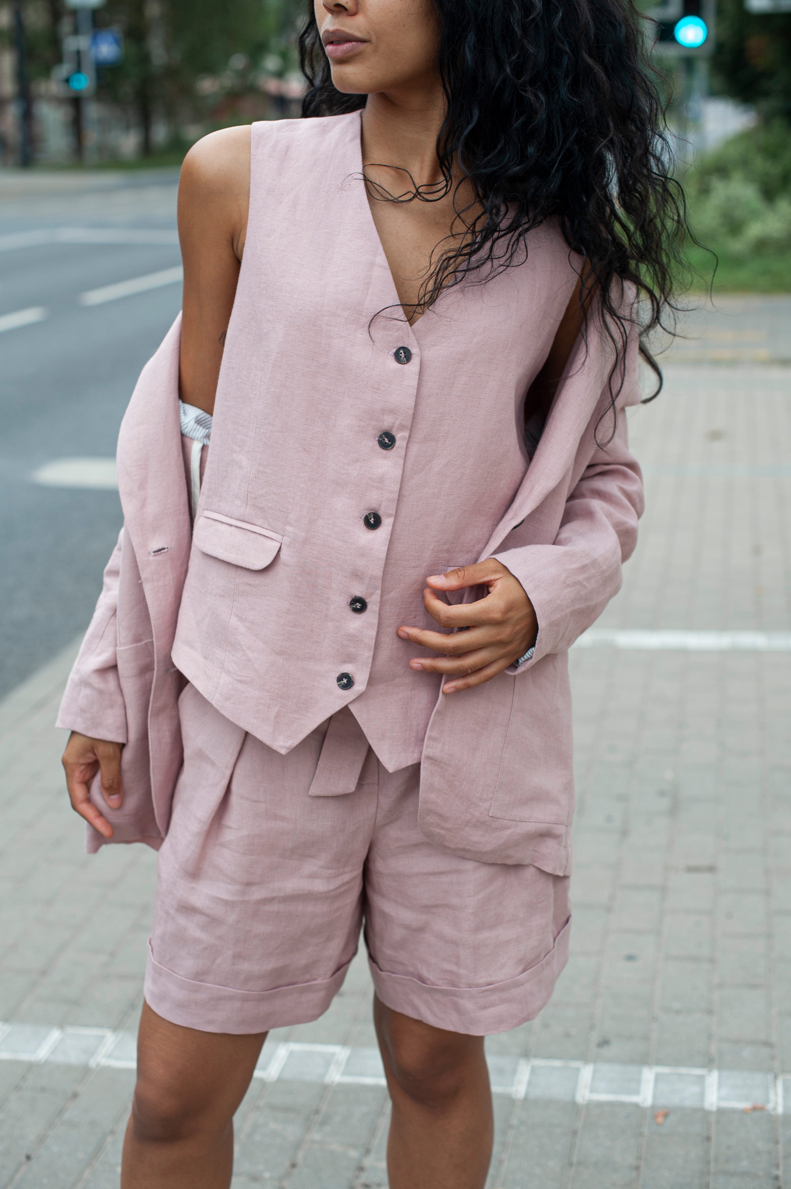 Dusty pink linen suit vest paired with matching pleated shorts