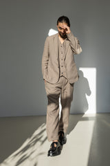 Men's three-piece linen suit featuring a blazer, waistcoat, and relaxed fit pants