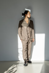Beige linen suit for men. Three-pieces linen suit featuring a blazer, button-up waistcoat,  and flat front pants