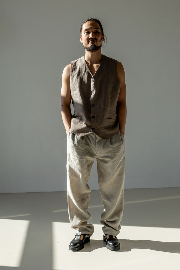 Men's classic linen pants paired with a beige waistcoat