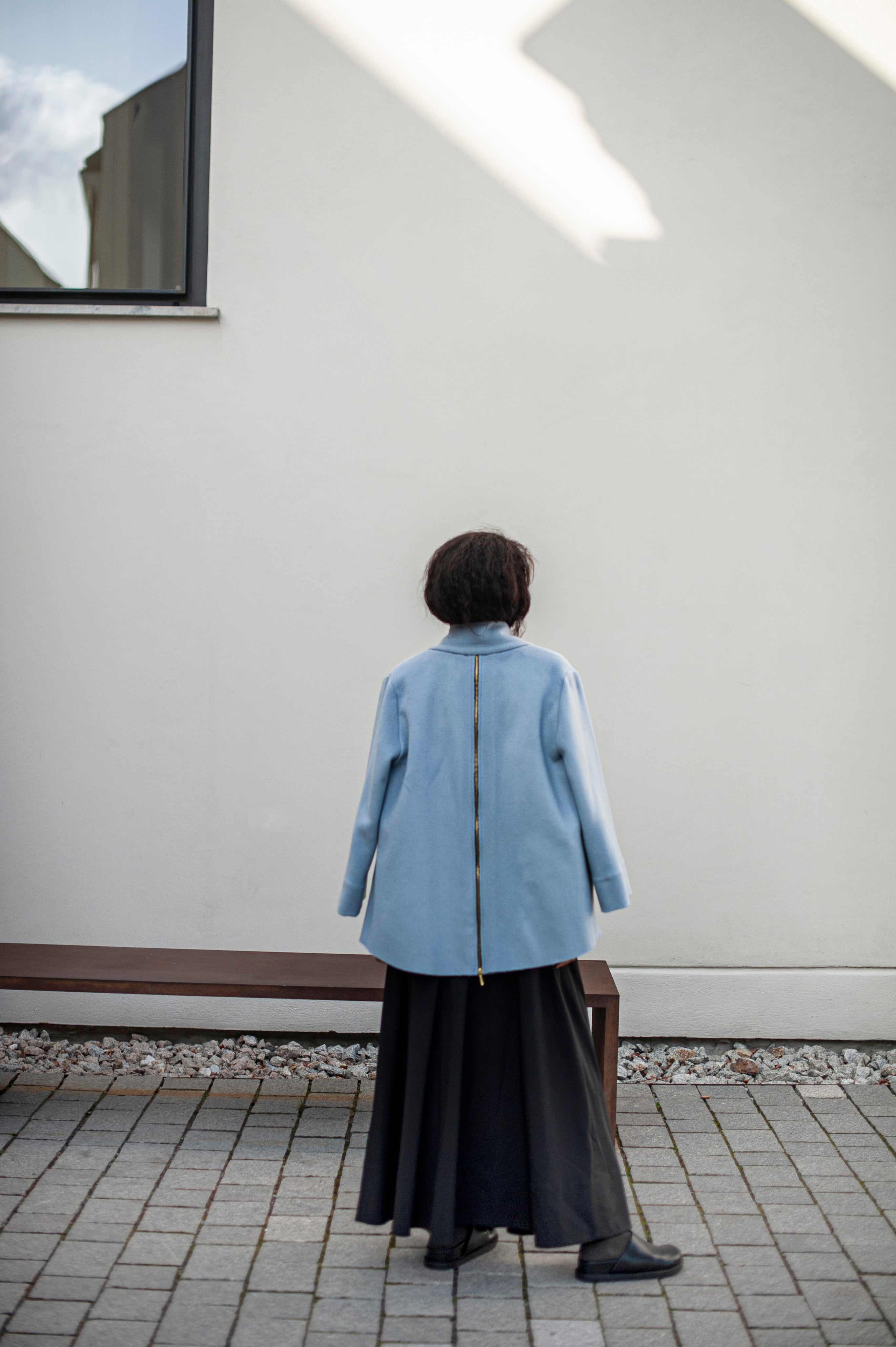 Elegant blue jacket and a wide, A-line silhouette black skirt