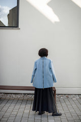 Elegant blue jacket and a wide, A-line silhouette black skirt