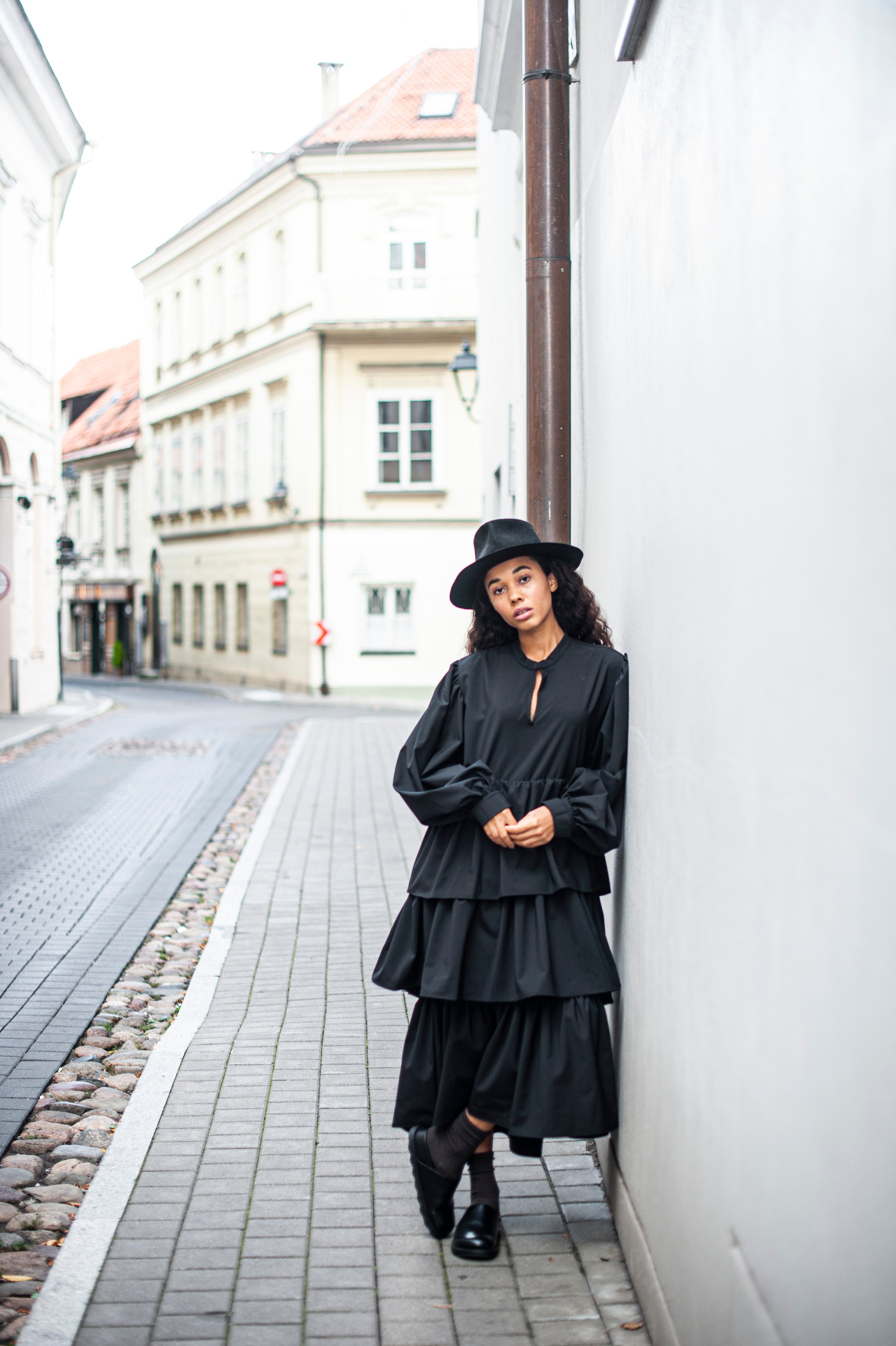 Long-sleeve A-line silhouette dress with ruffles.