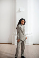 Women's button-up wool shirt with a collar, back pleat, and two front pockets.
