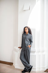 Elegant wool shirt with front pockets. Dialed up with pleated wide leg trousers.