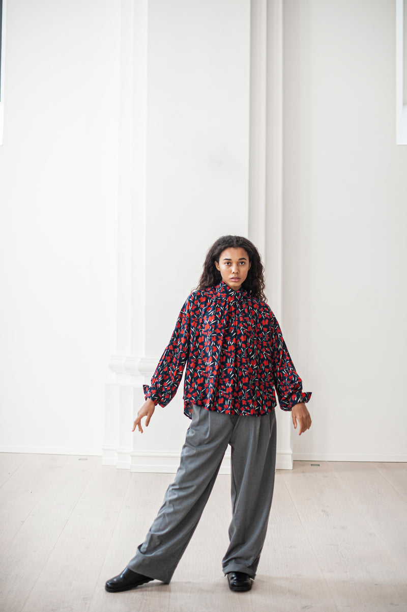 Loose-fitting Merino wool culottes paired with a flower print blouse