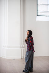 Two-piece outfit of a flower blouse and light-weight Merino wool pleated trousers