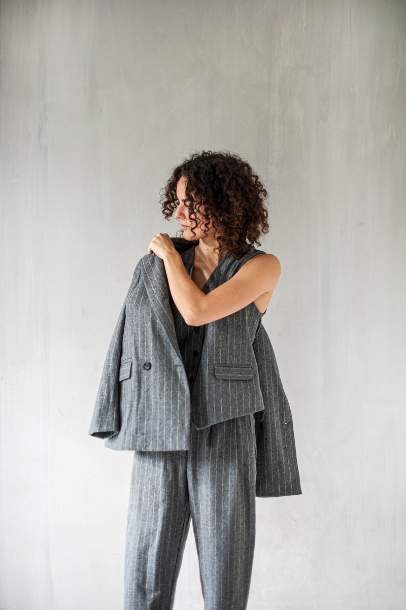 A classic three-piece suit with a modern twist for women
