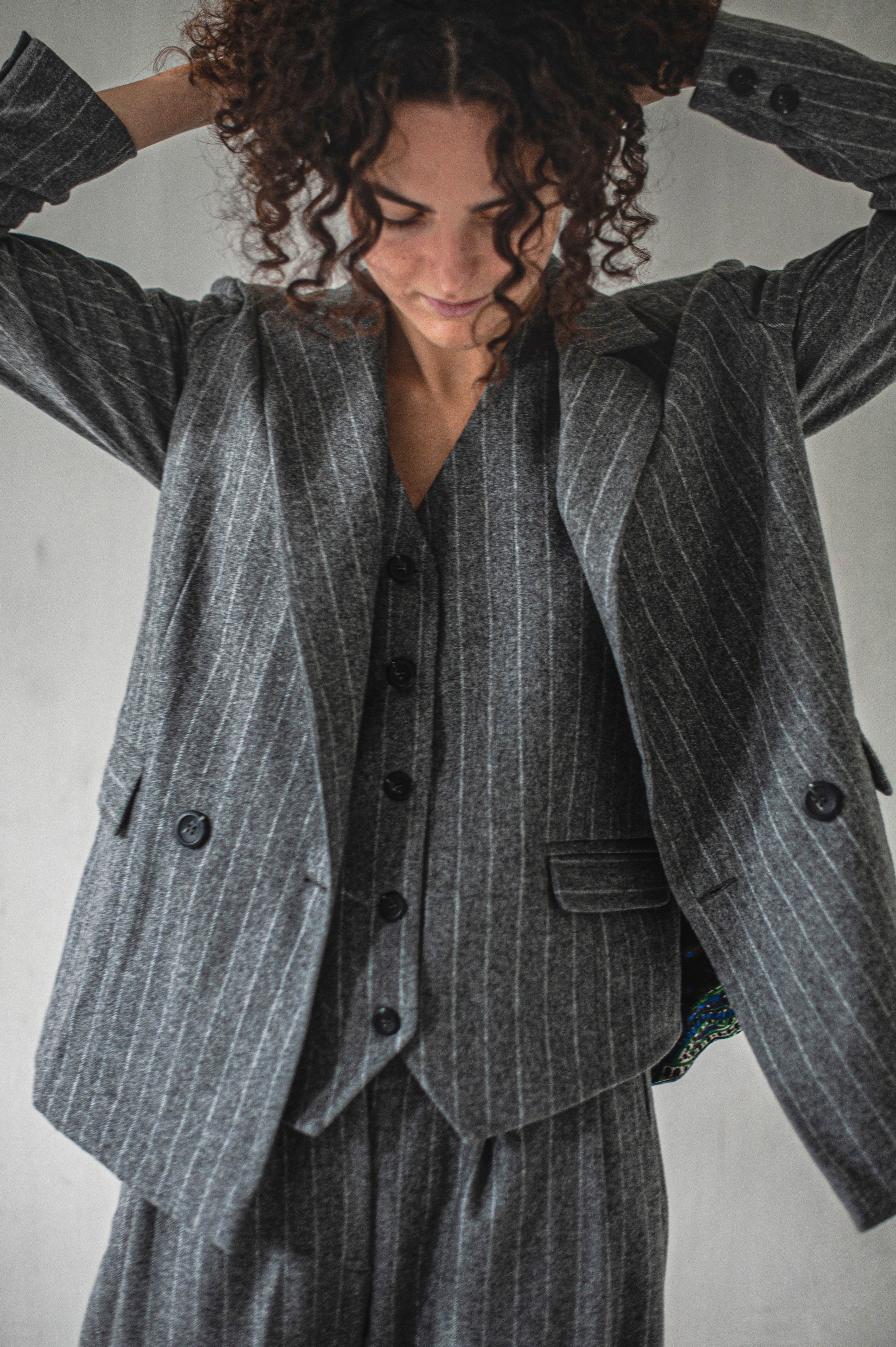 Fully linen grey striped blazer over a matching waistcoat.