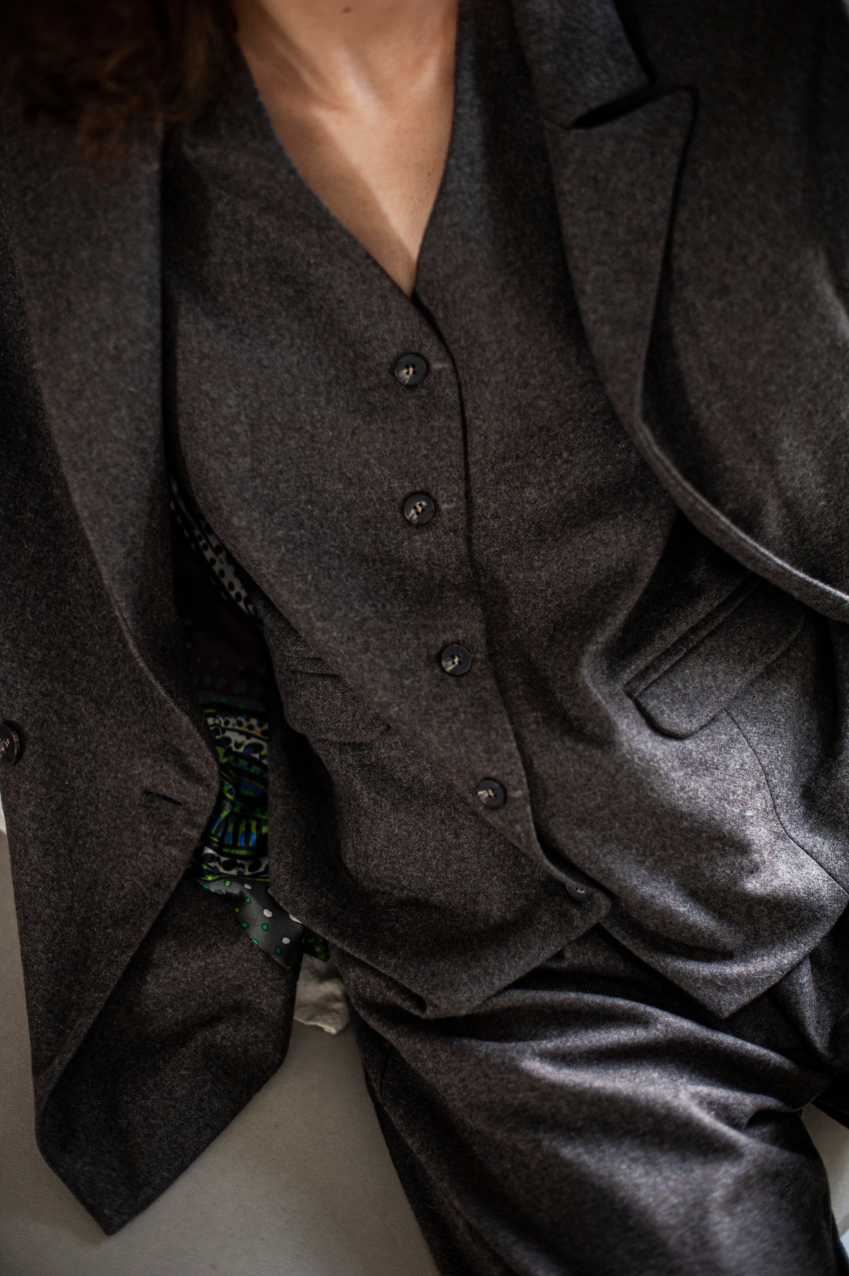 A classic wool vest under a tailored, matching blazer.